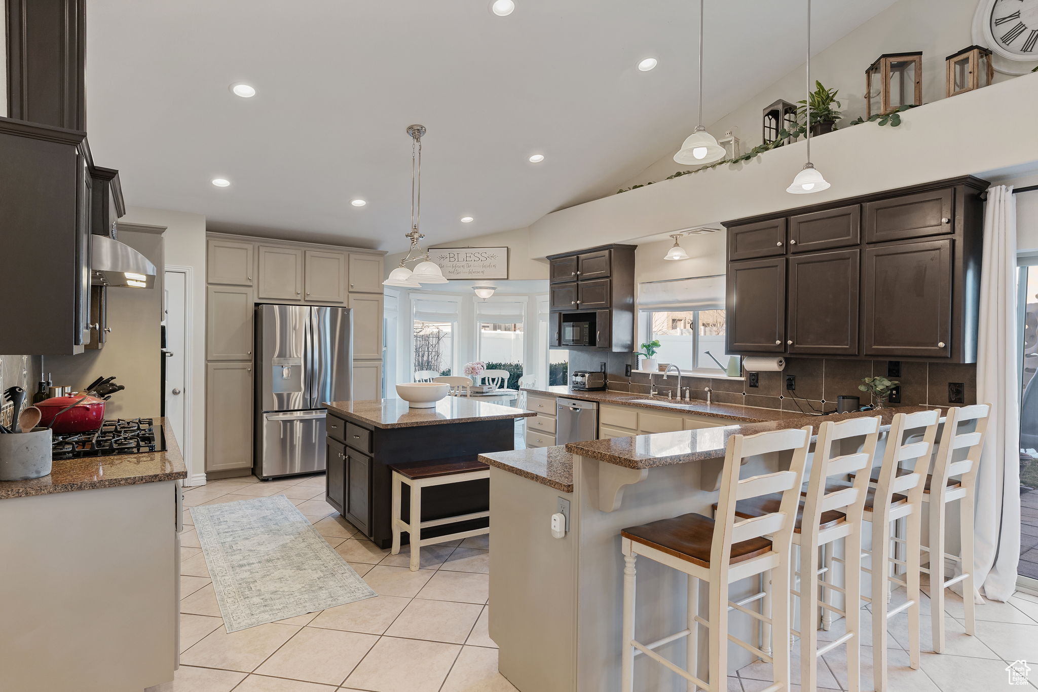 Gorgeous and spacious kitchen. Great for entertaining. Gas Stove. Double Oven. Can Lighting. High bar for informal eating. Island for prep and serving. Pantry. Abundant Cabinetry.