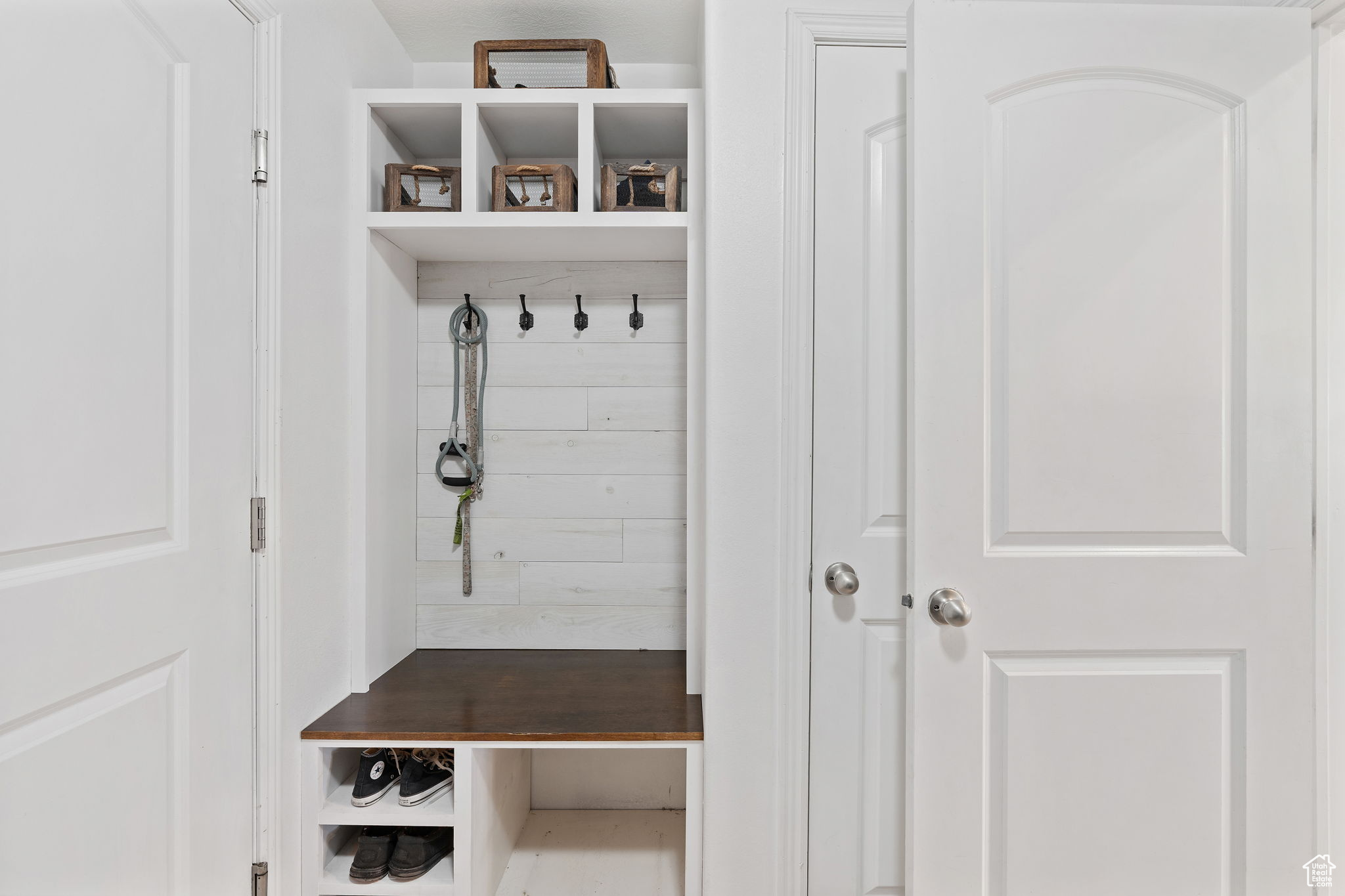 Laundry room, mud room, featuring cabinets and a sink.