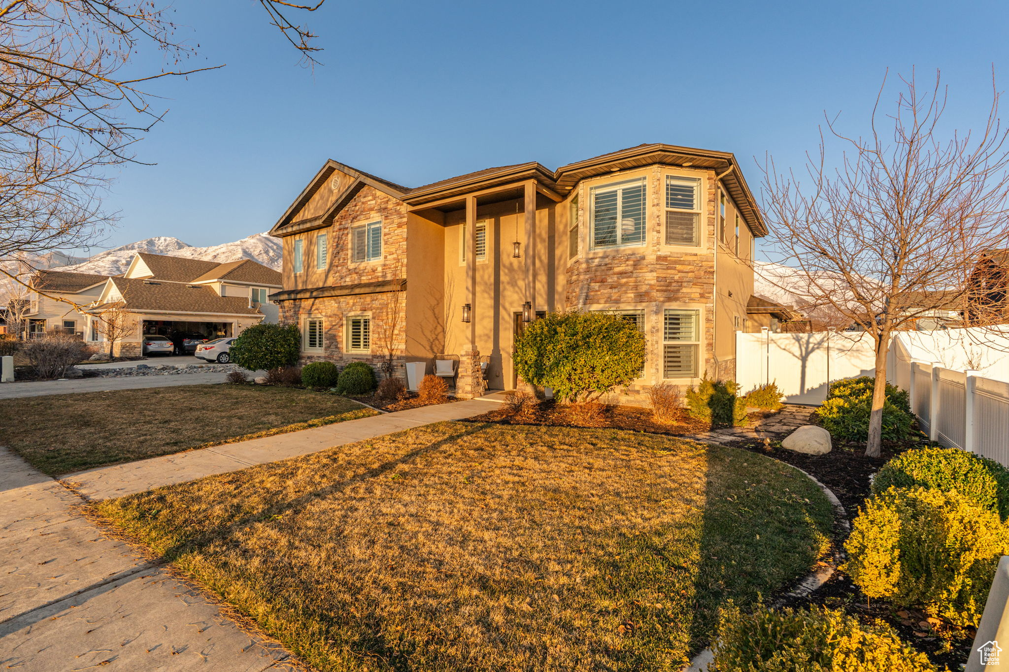View of the front of the home looking northeast. Gorgeous and well maintained landscaping.