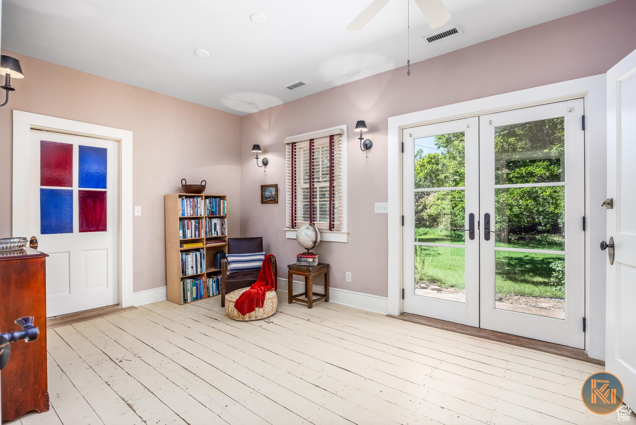Entryway with french doors, hardwood / wood-style flooring, visible vents, and baseboards