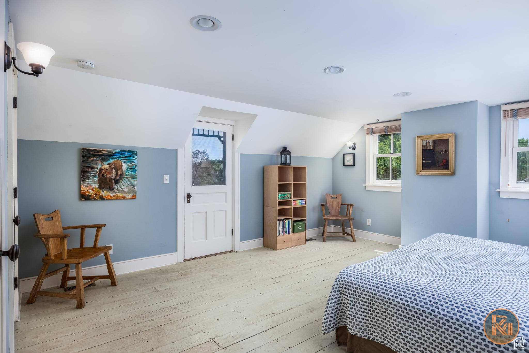 Bedroom featuring light wood-style flooring, baseboards, vaulted ceiling, and recessed lighting