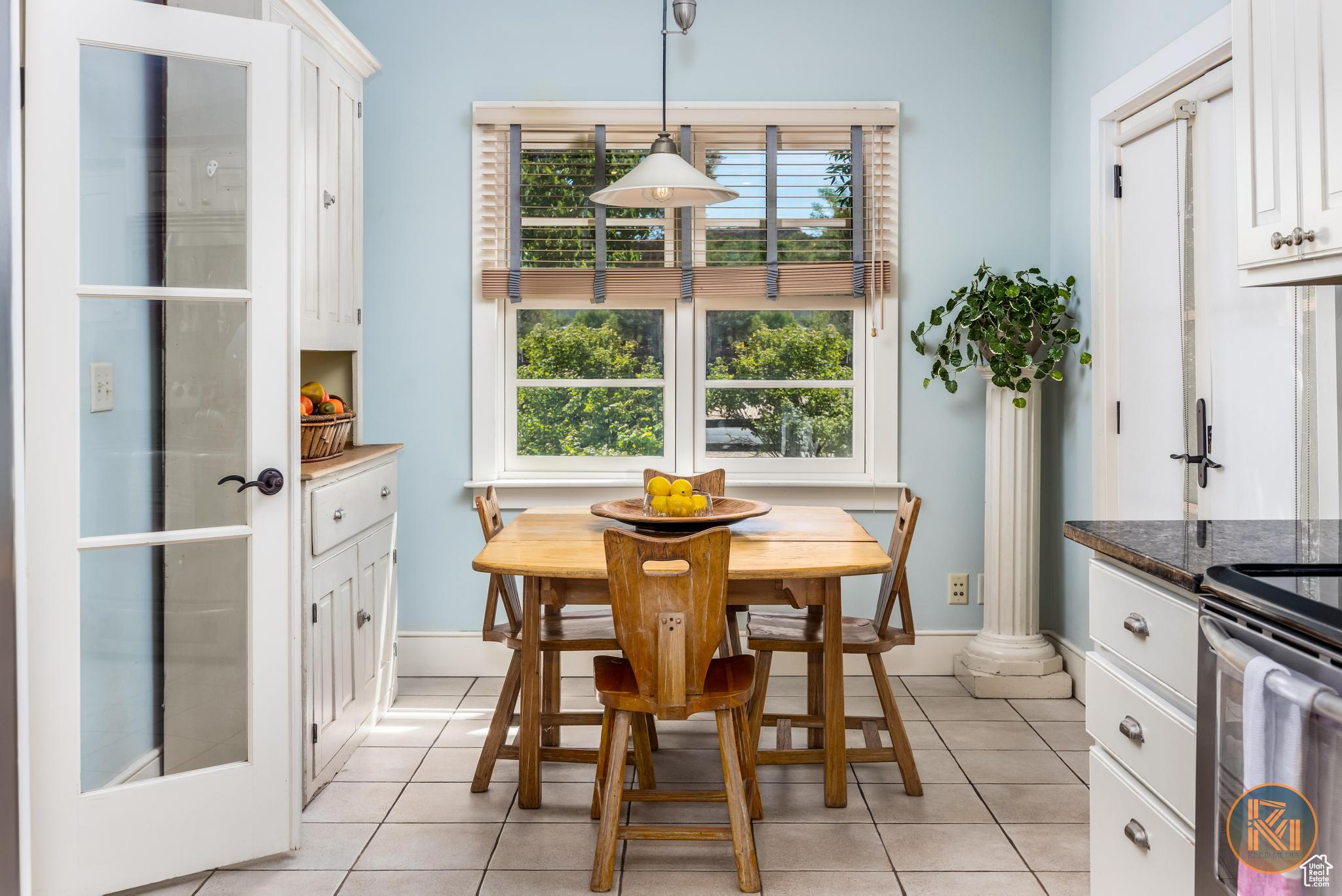 Dining room featuring baseboards and light tile patterned floors