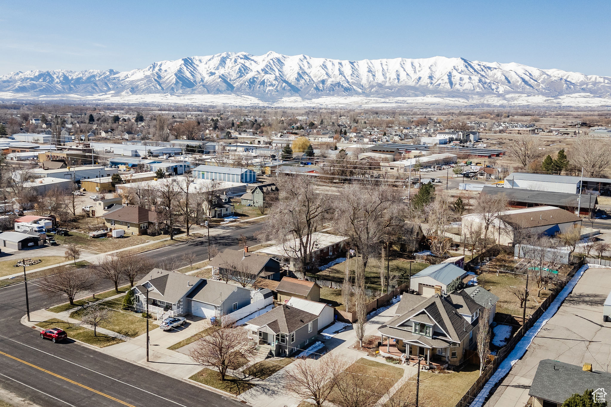 Birds eye view of property with a mountain view and a residential view