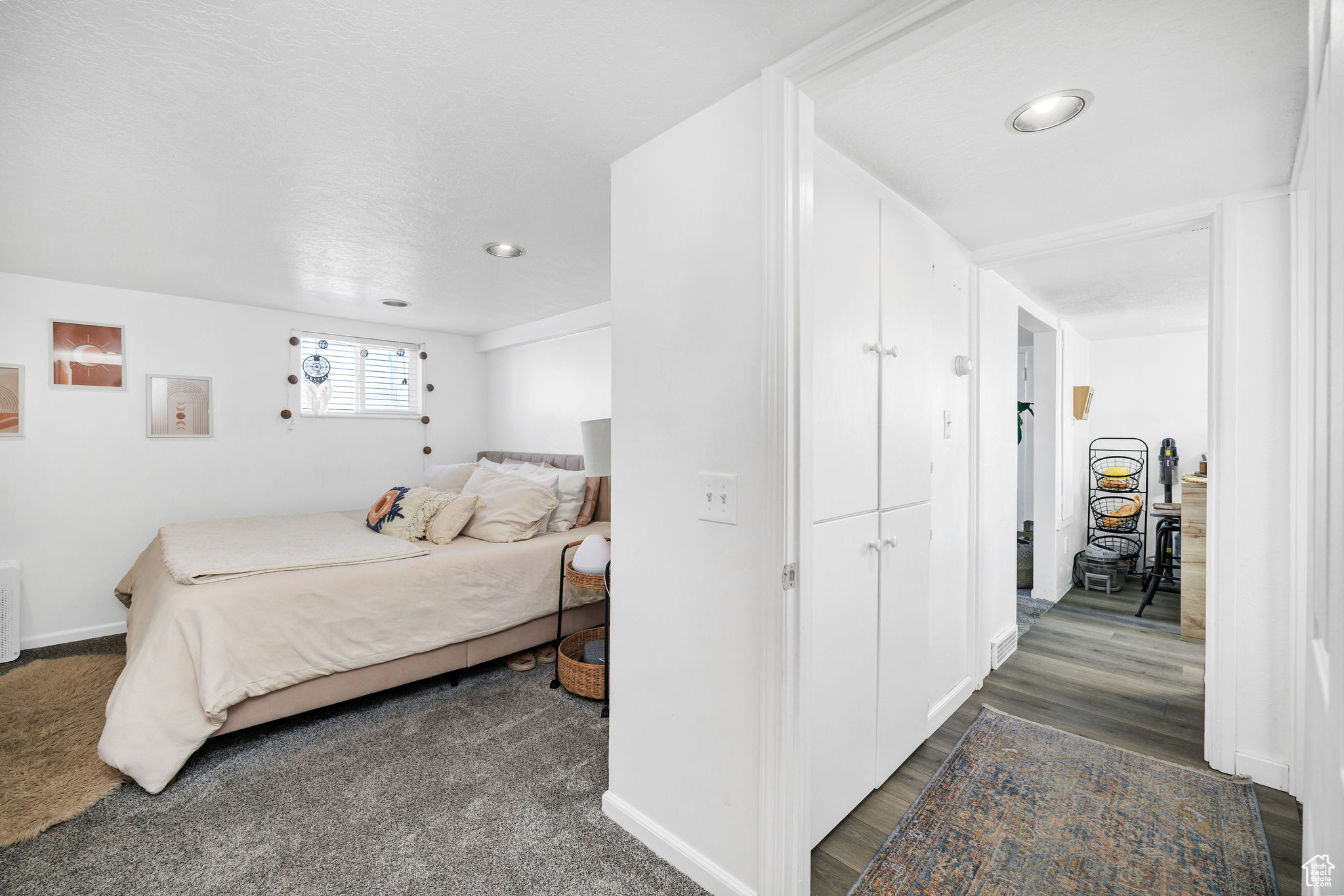 Bedroom with recessed lighting, baseboards, and dark wood-type flooring