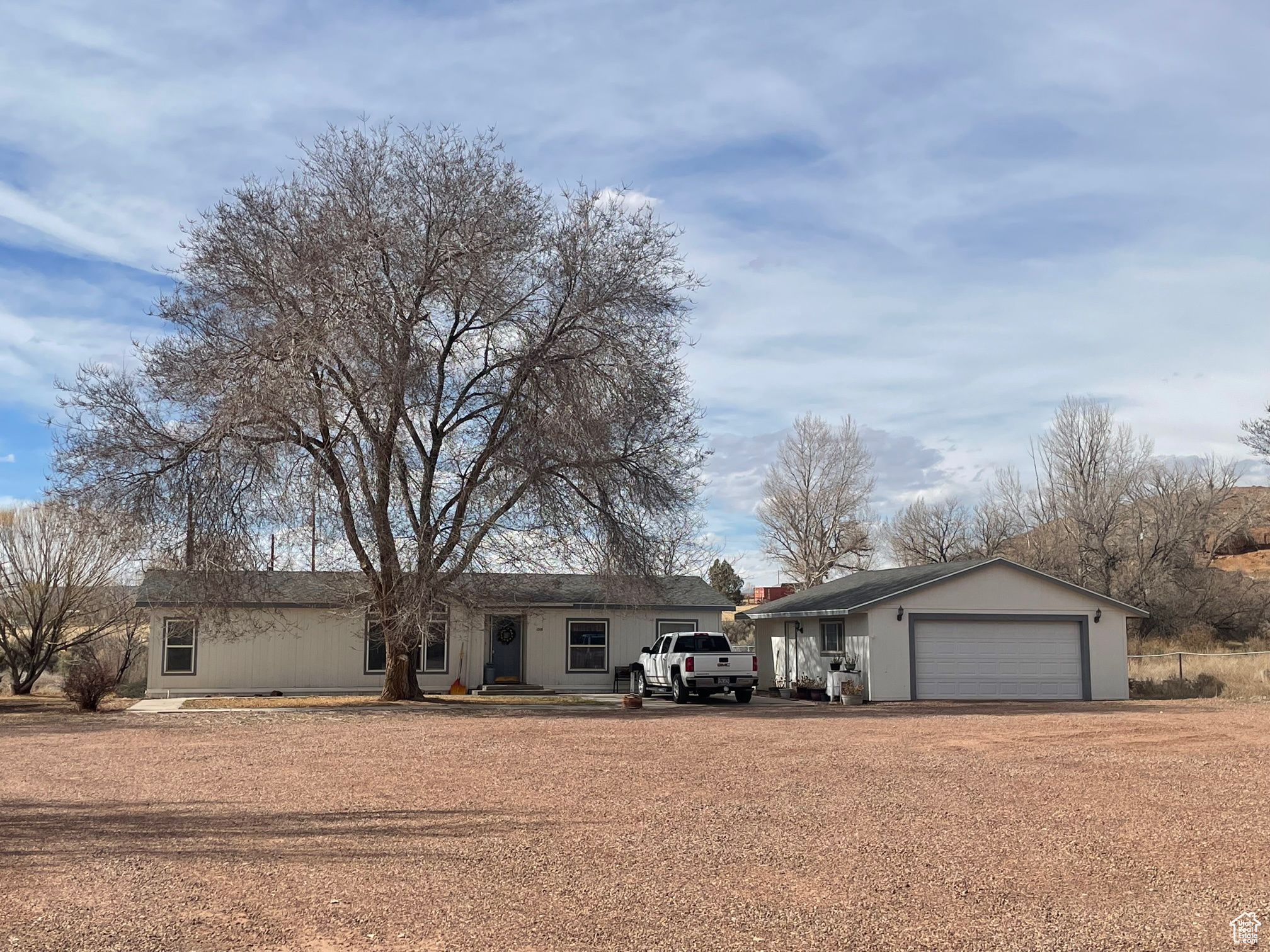 Ranch-style home featuring driveway