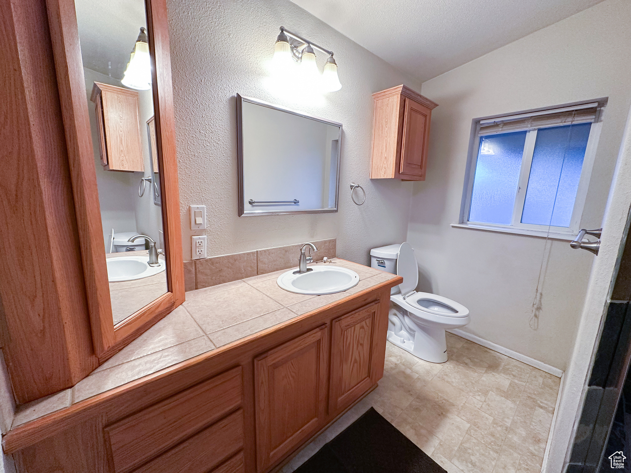 Bathroom with vanity and toilet