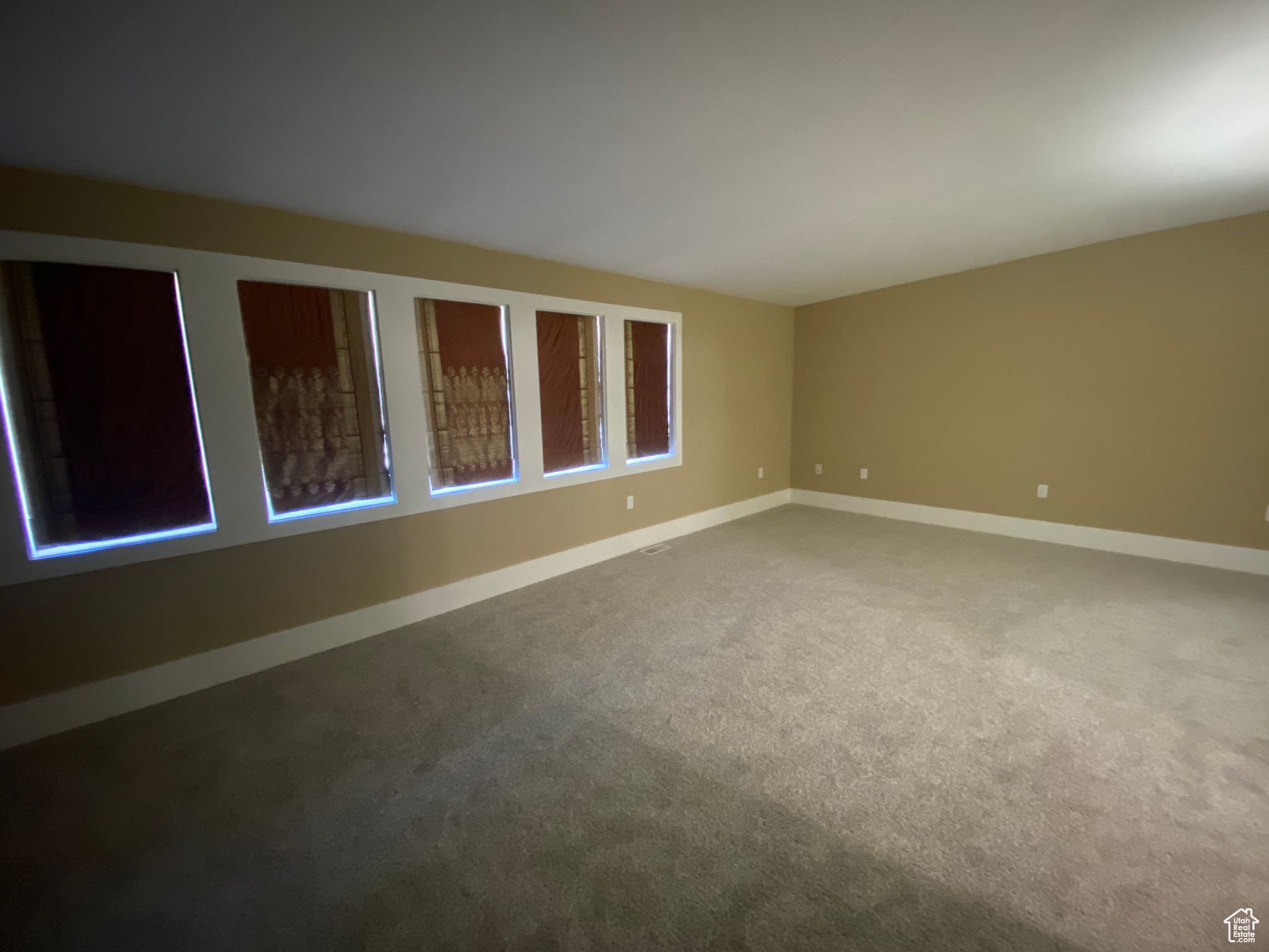 Empty primary bedroom. Pella window with view of mountains.