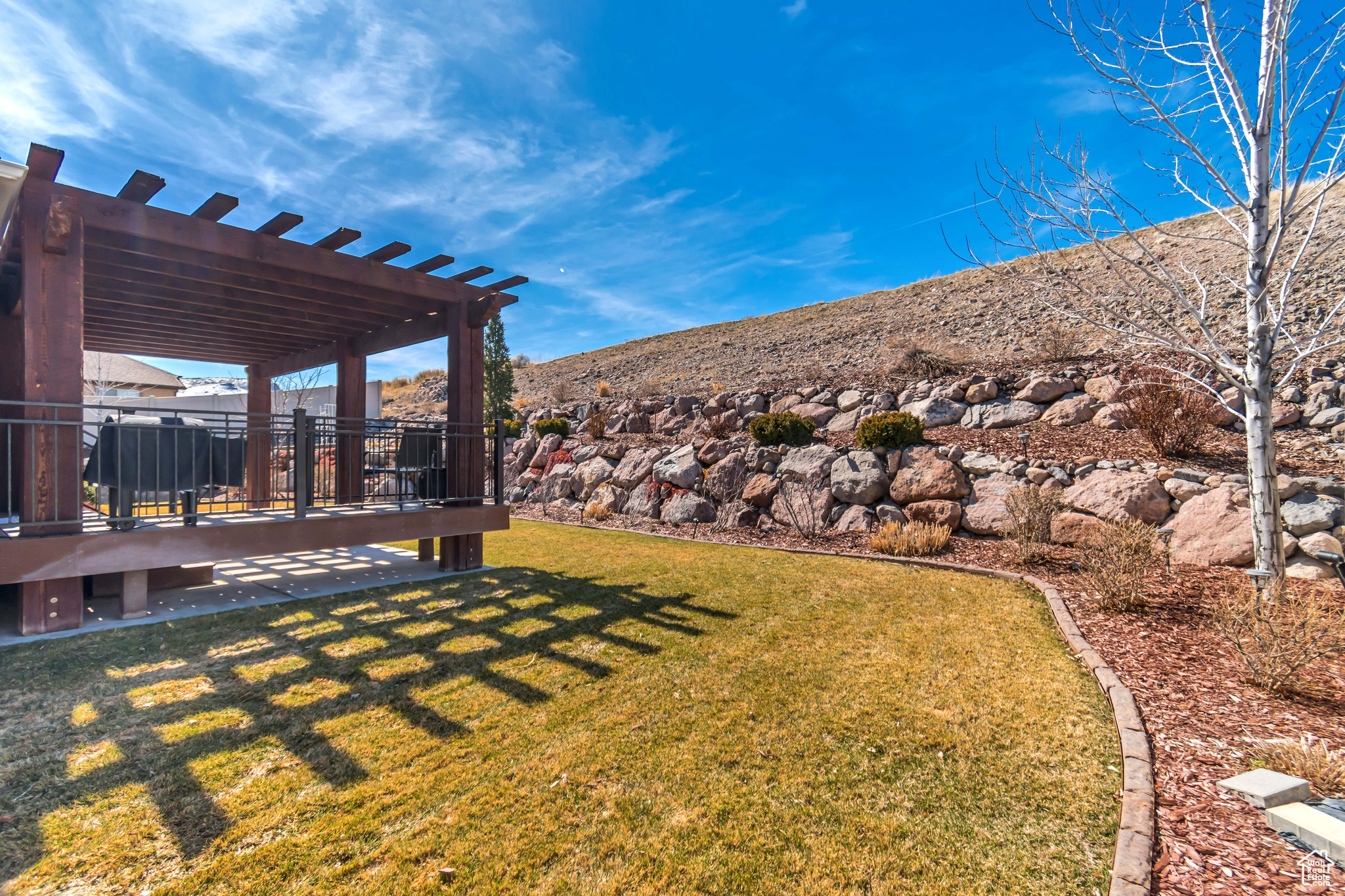 View of backyard with a pergola
