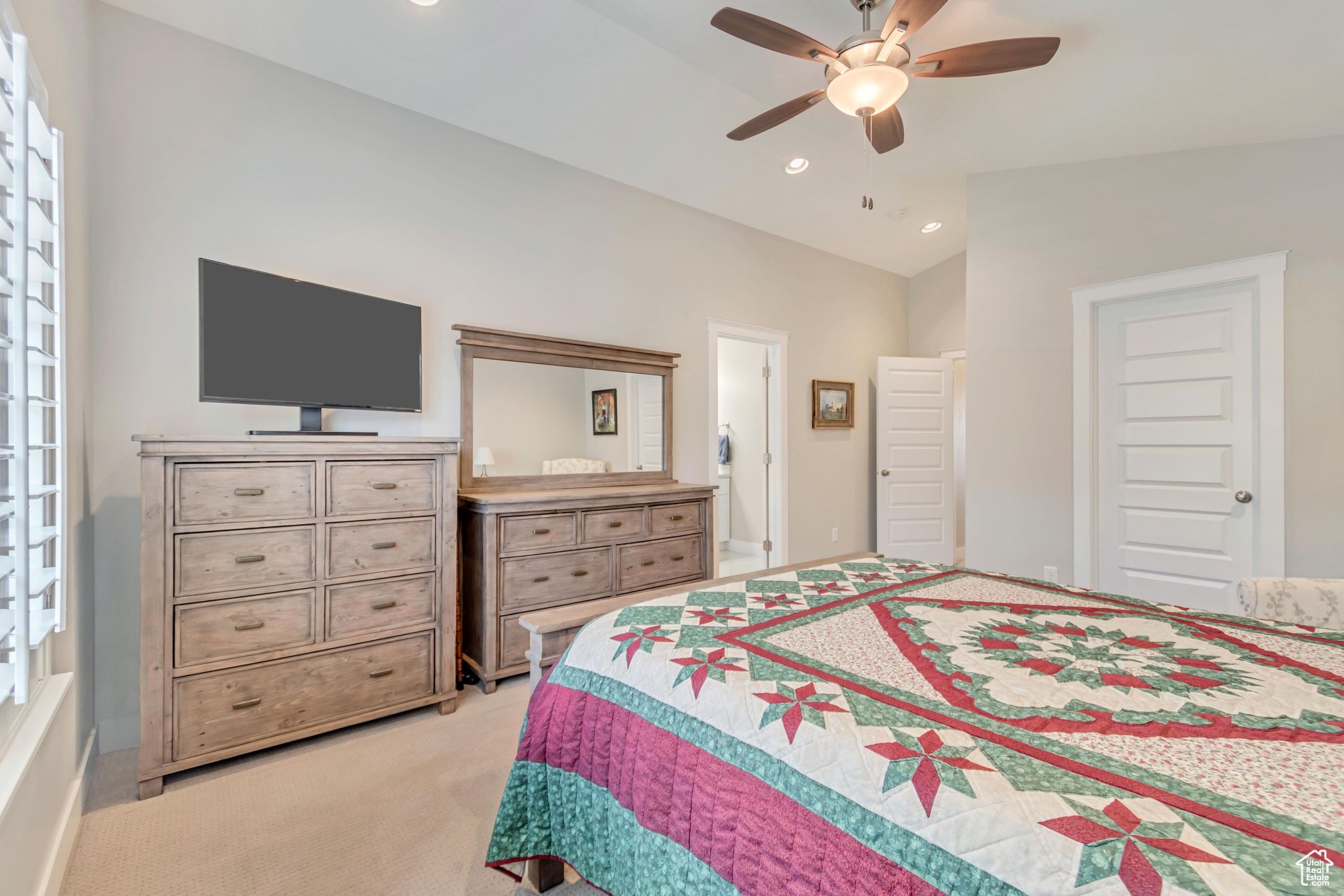 Master bedroom with vaulted ceilings, walk-in closet and ensuite bathroom