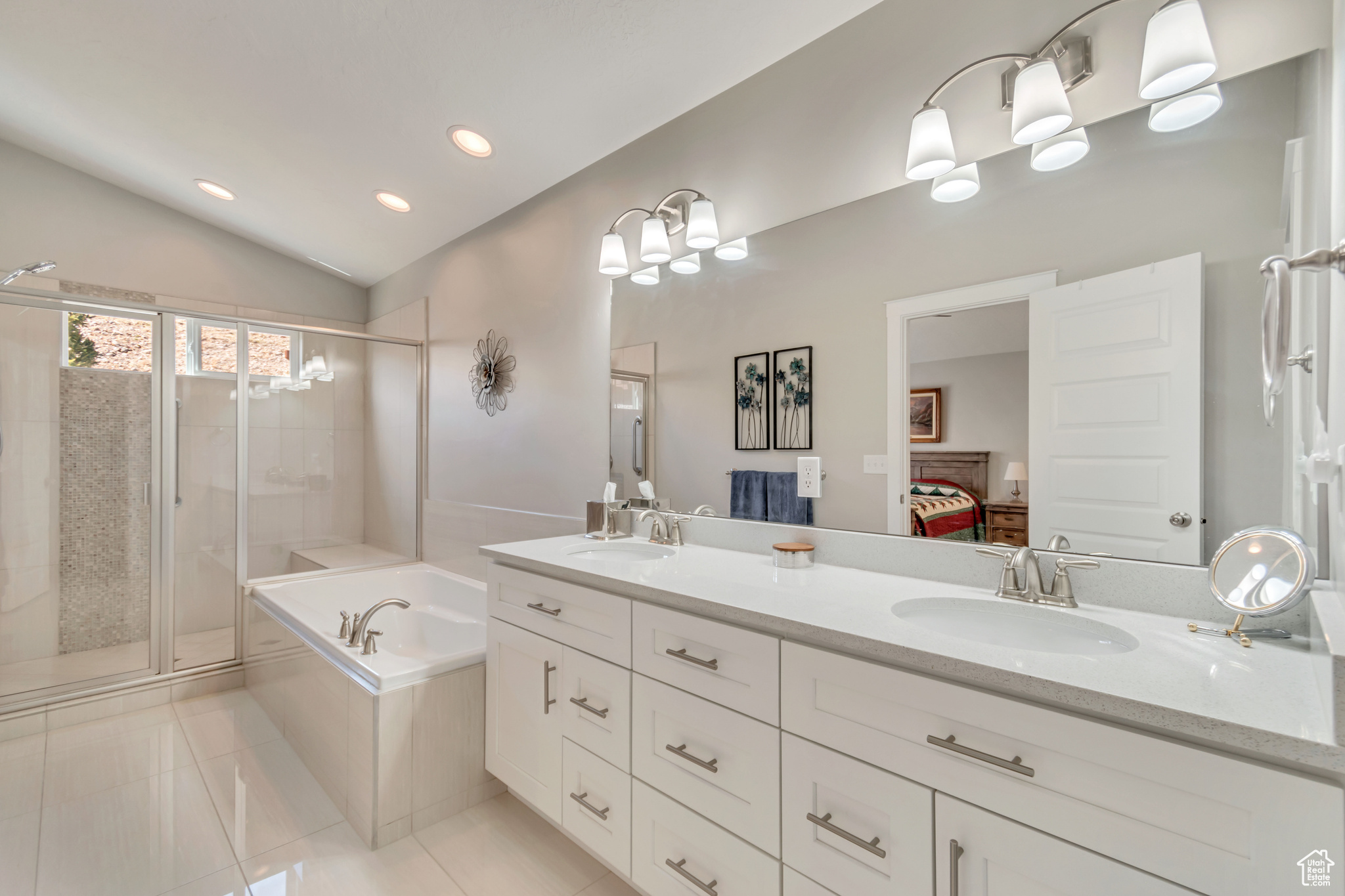 Gorgeous master bathroom with double sinks, separate shower/tub and custom tile work