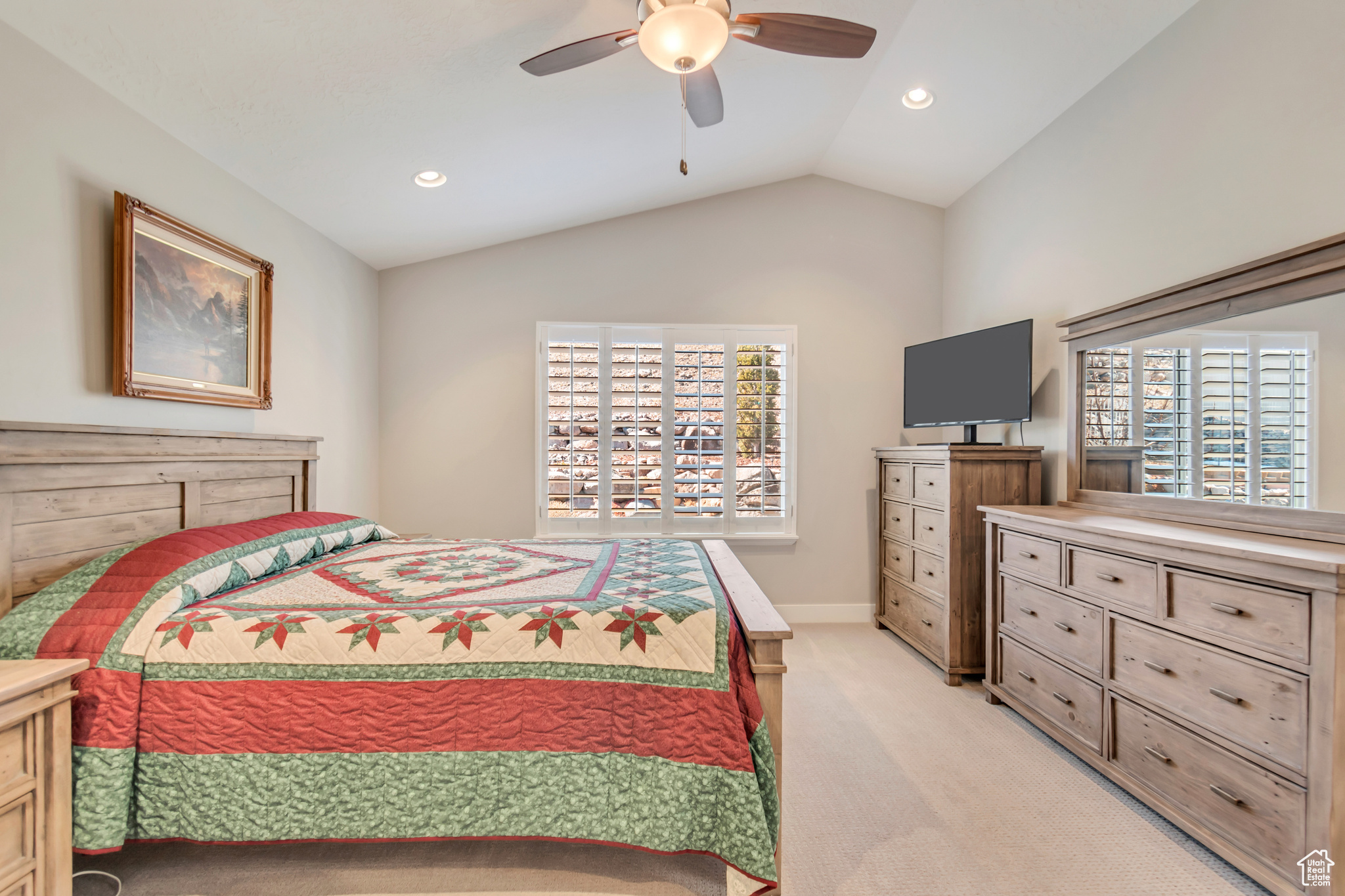 Master bedroom with vaulted ceilings, walk-in closet and ensuite bathroom