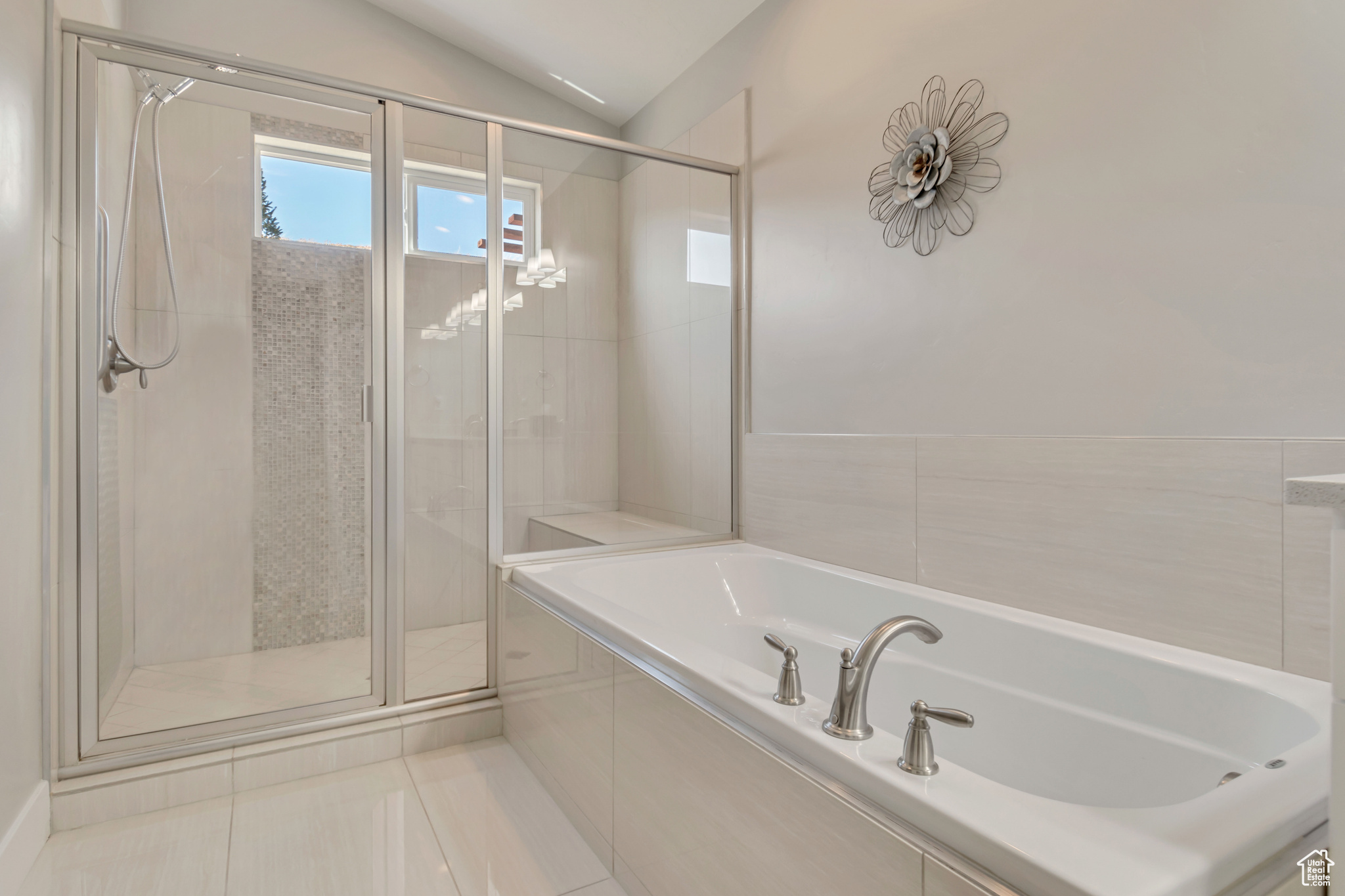 Gorgeous master bathroom with double sinks, separate shower/tub and custom tile work