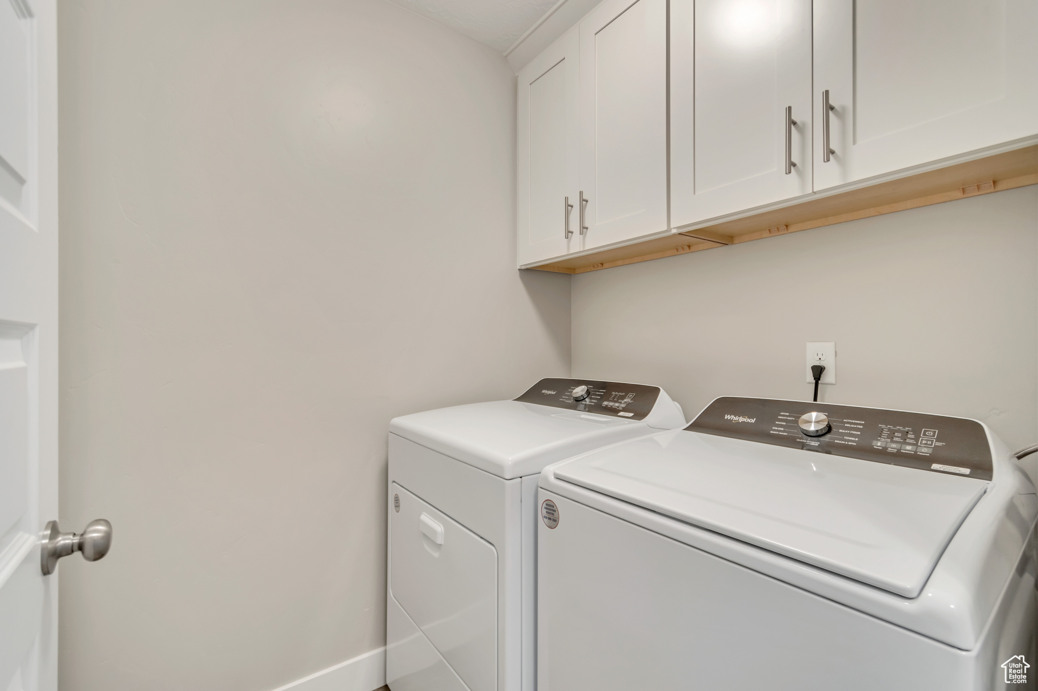 Laundry room, cabinet space, storage cupboard behind door