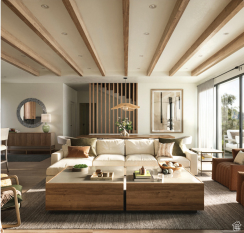 Living area featuring beam ceiling and wood finished floors