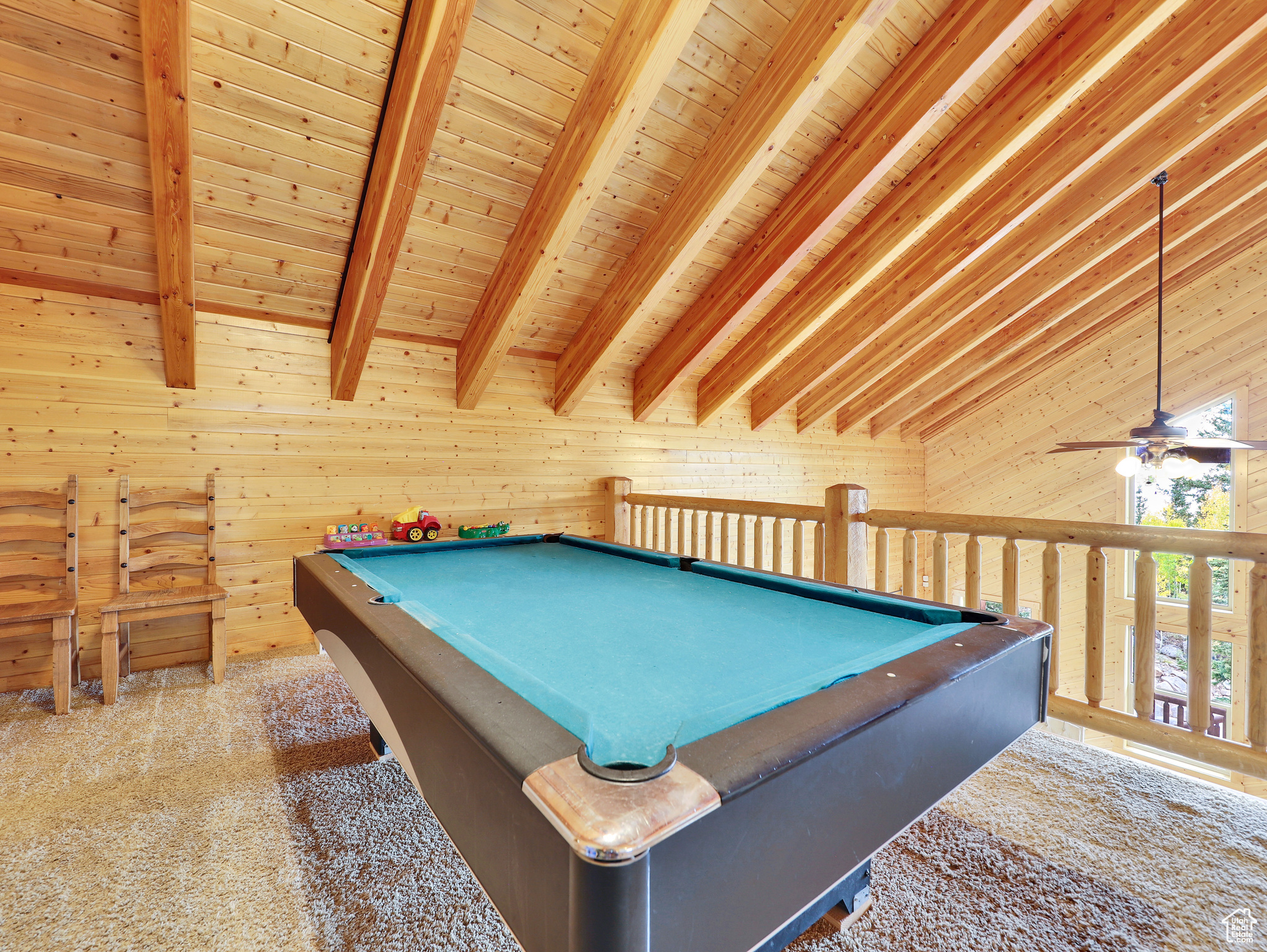 Recreation room with carpet flooring, pool table, wood ceiling, and a ceiling fan