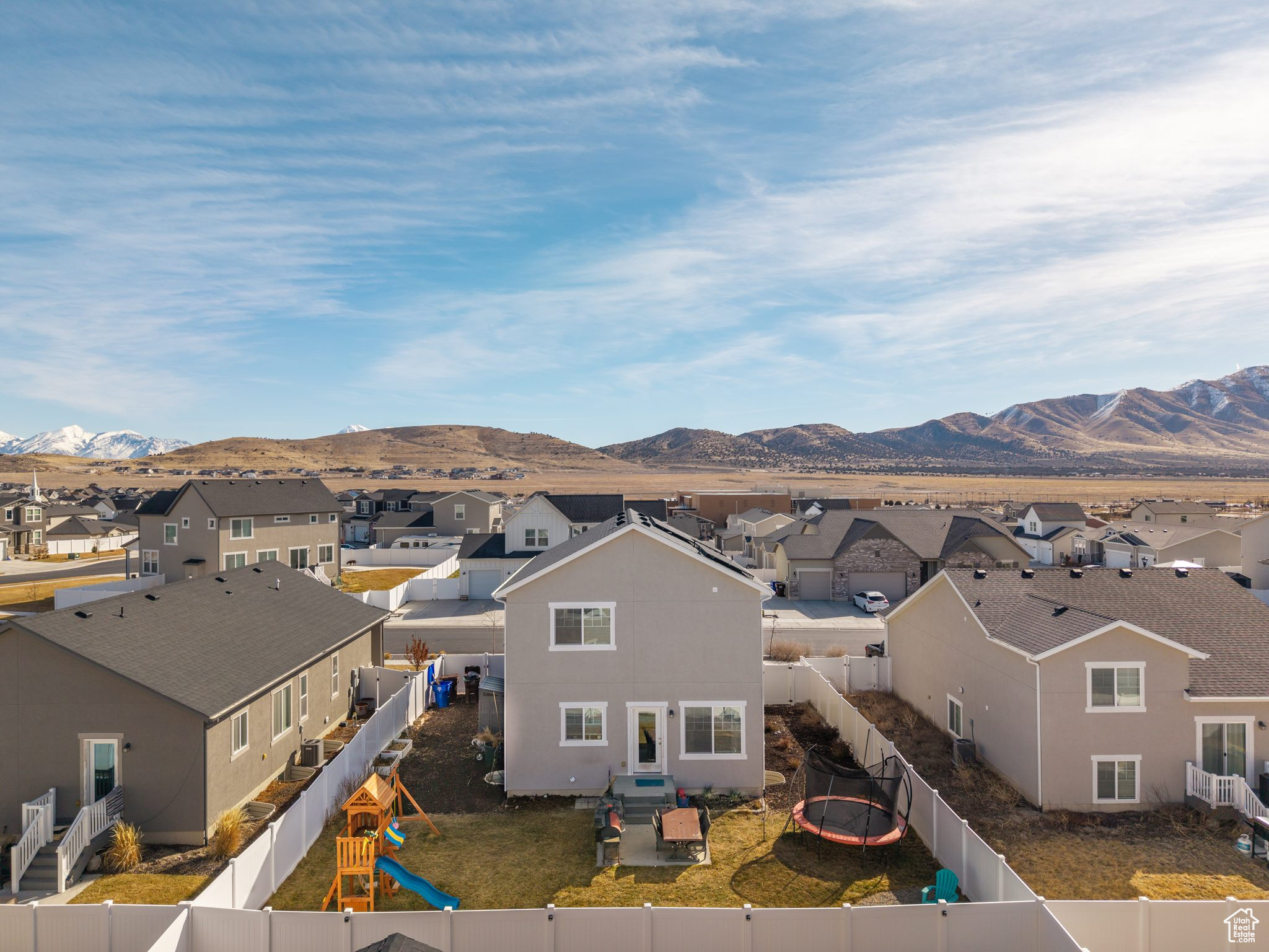 Property view of mountains with a residential view