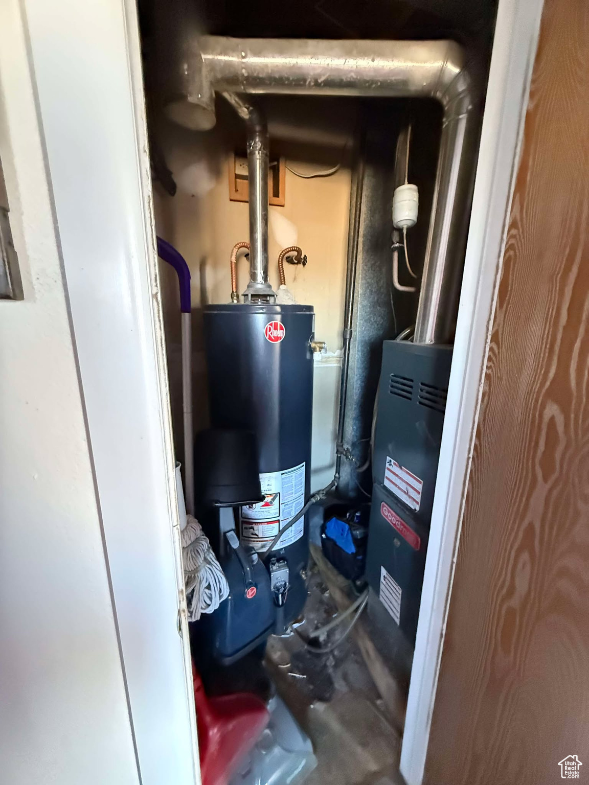 Utility room featuring water heater