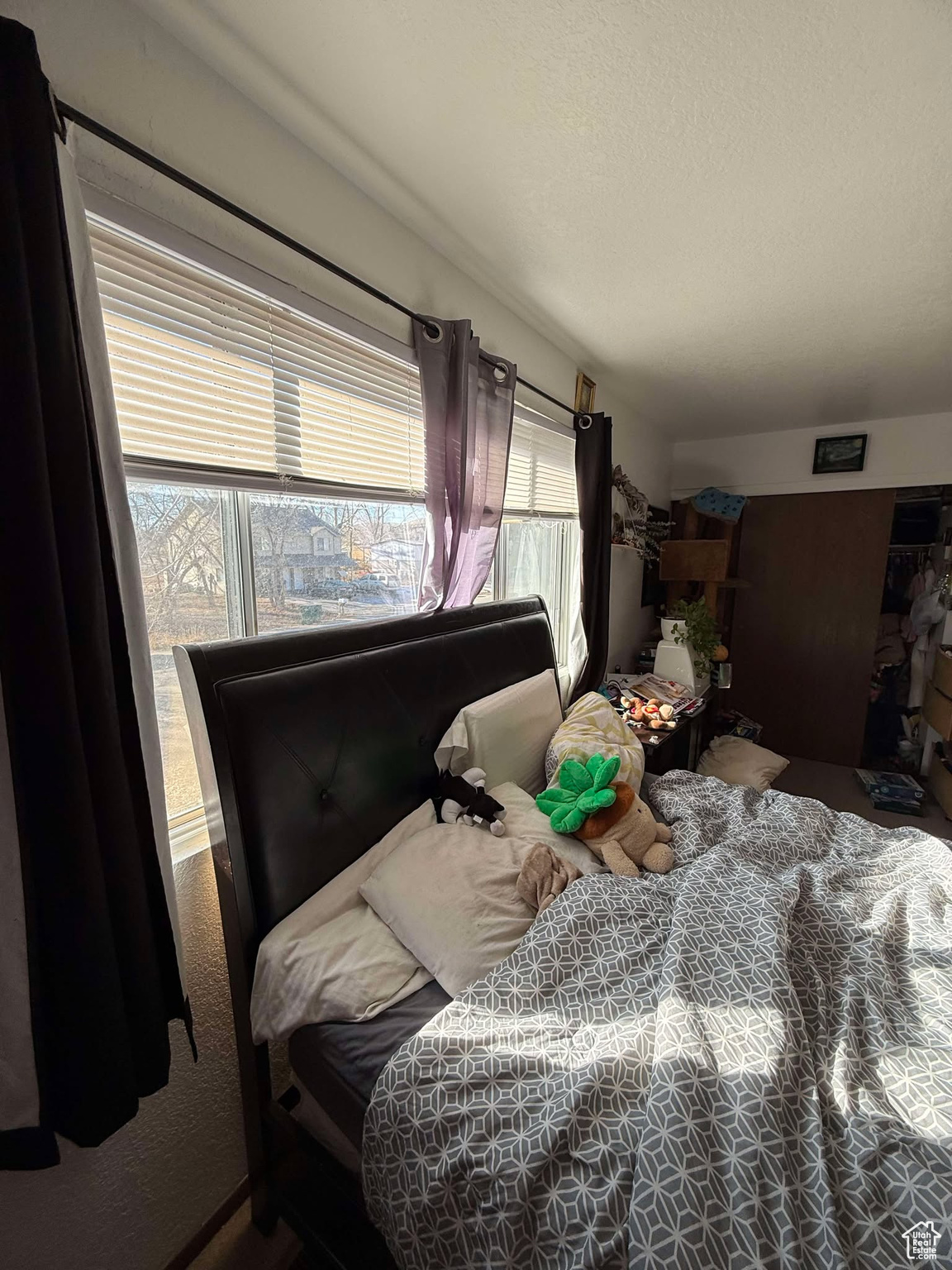 Bedroom with a textured ceiling