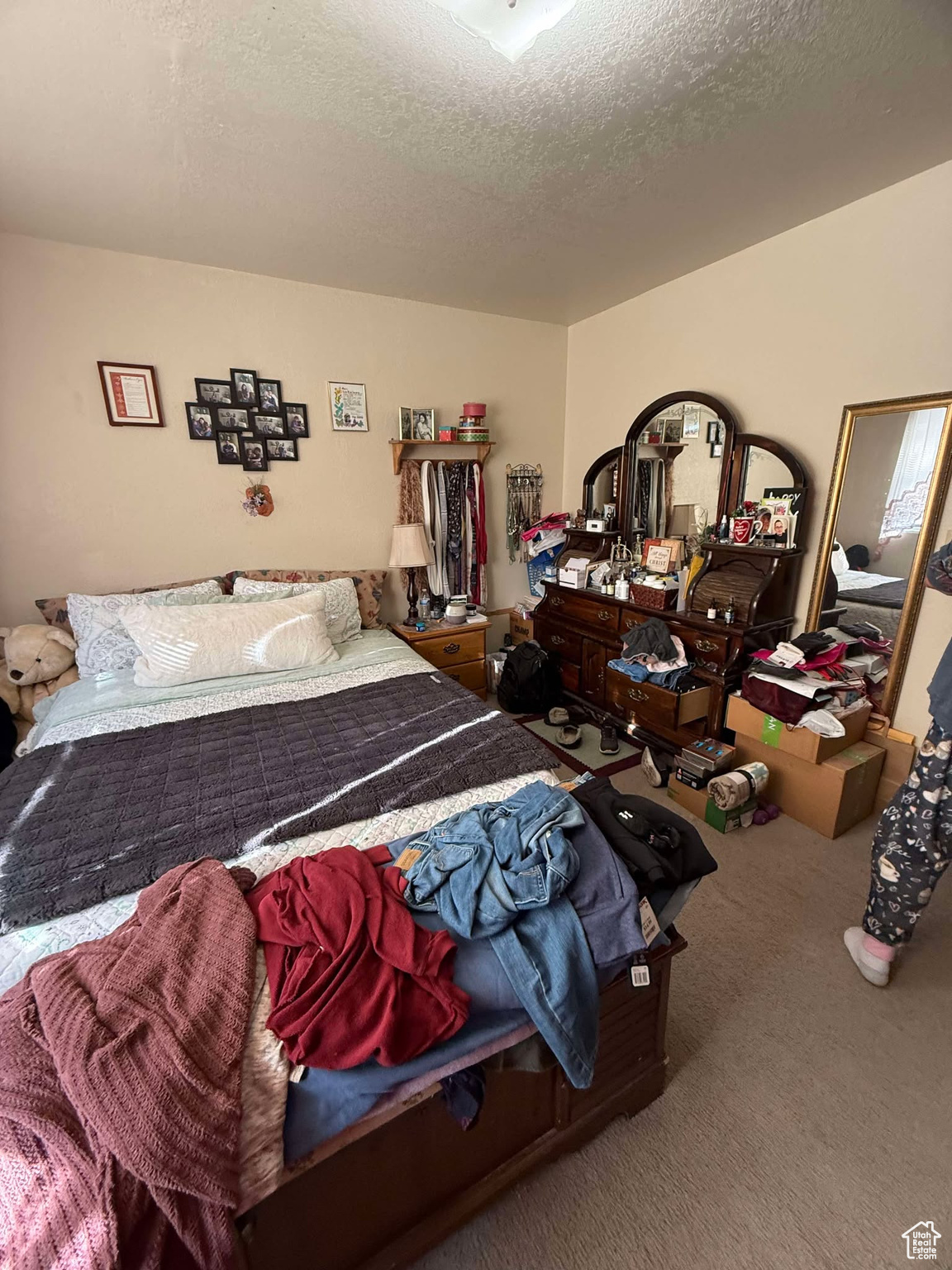 Carpeted bedroom with a textured ceiling