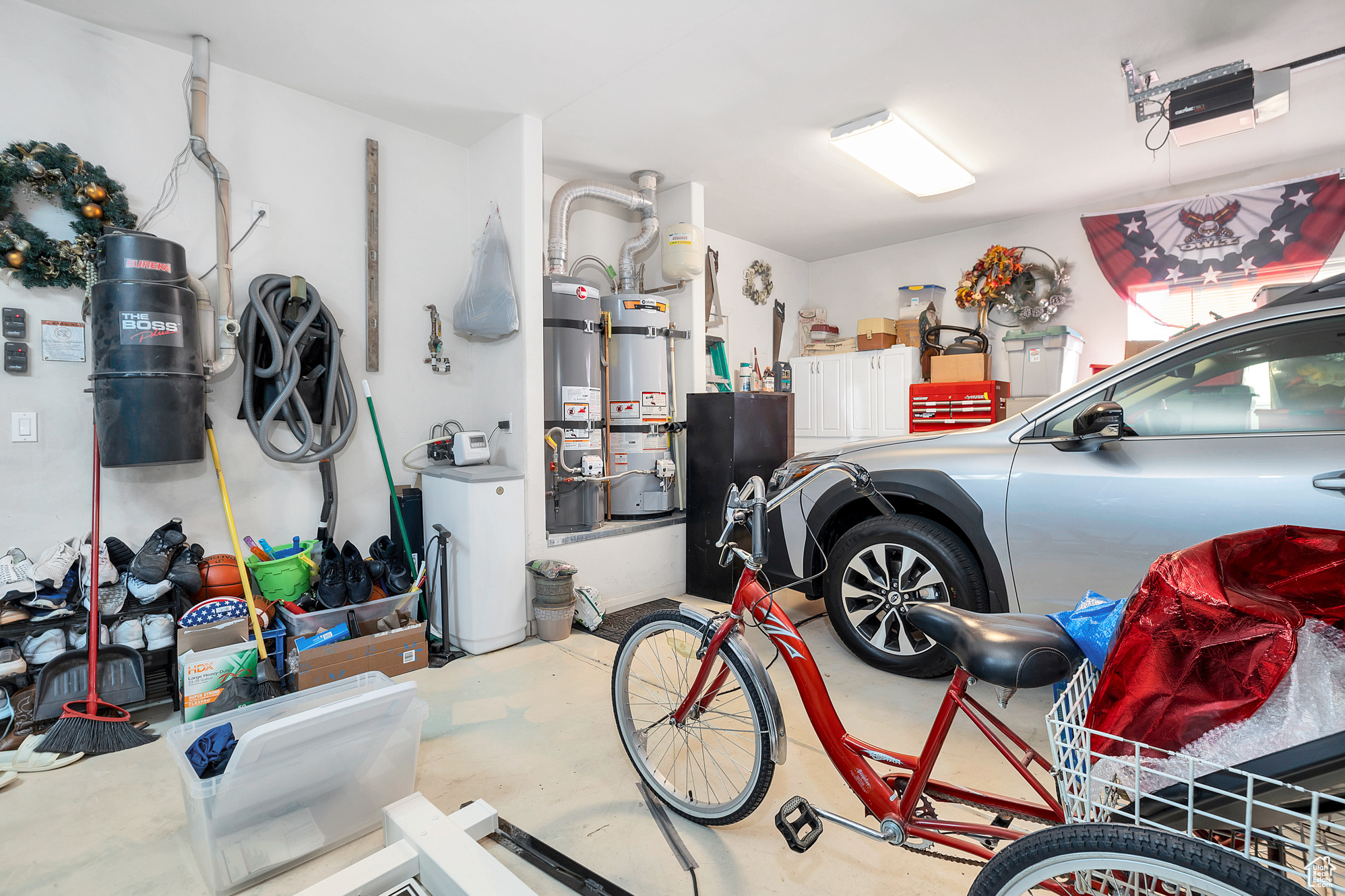 Garage featuring secured water heater