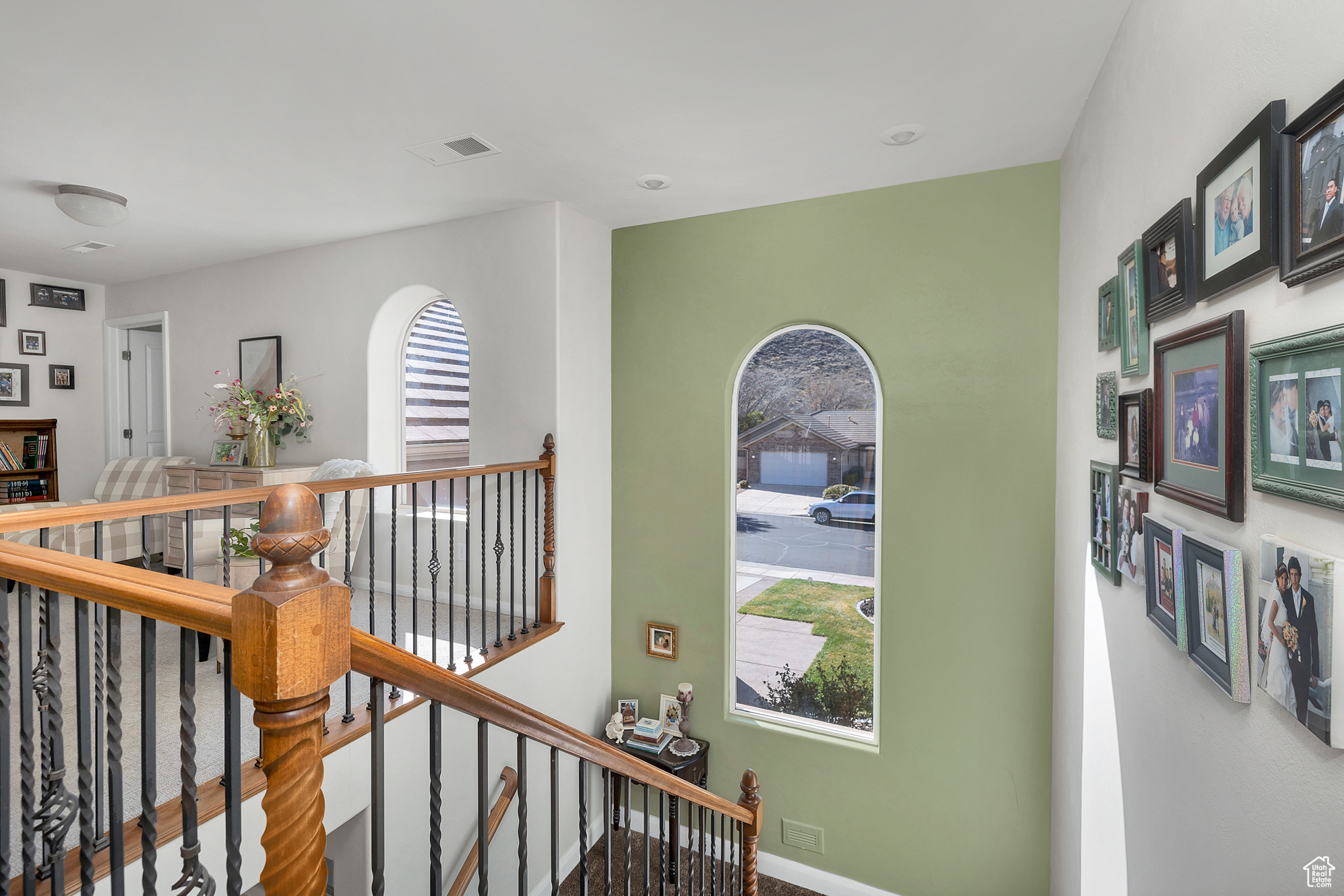 Hall with an upstairs landing and visible vents