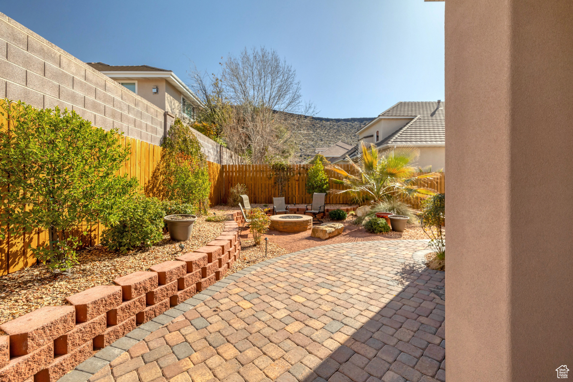 View of patio / terrace with a fenced backyard and an outdoor fire pit
