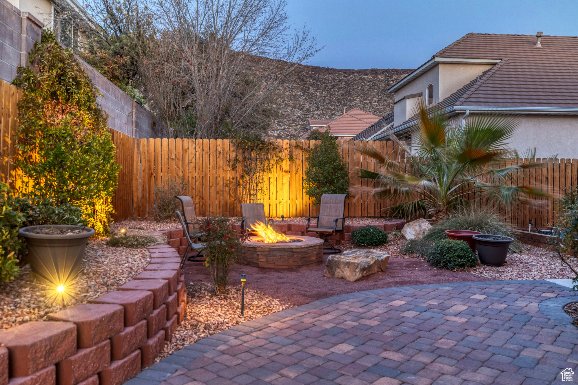 View of patio / terrace with a fenced backyard and an outdoor fire pit