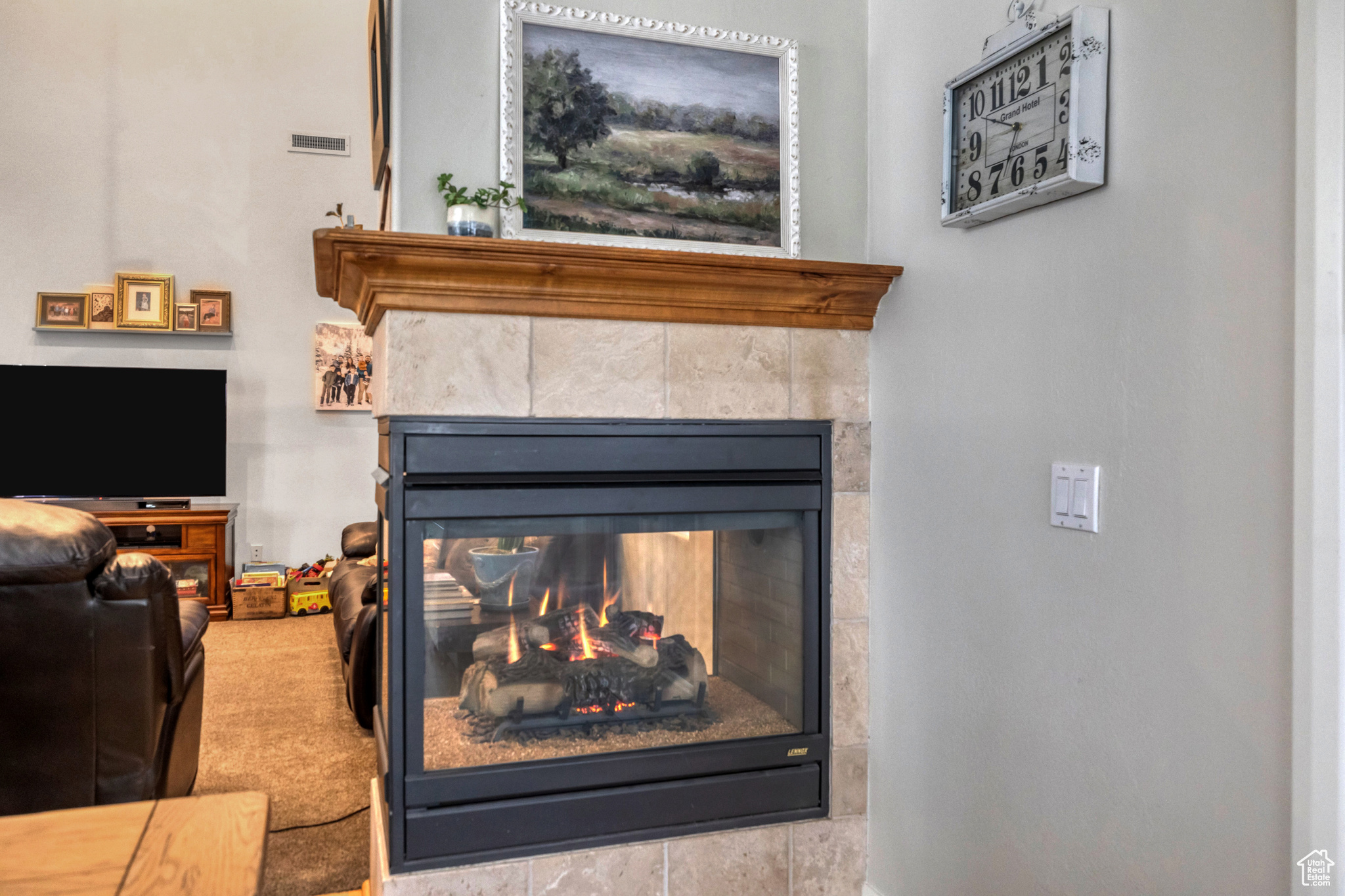 Room details with a tiled fireplace