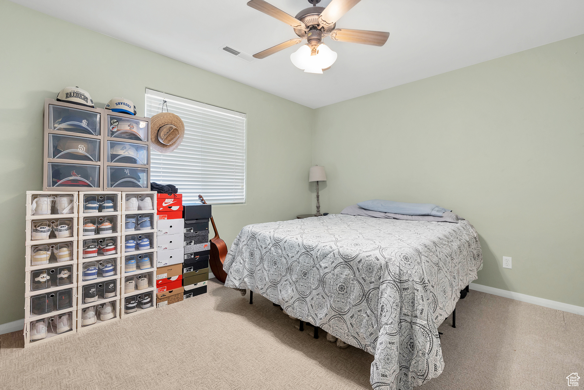 Bedroom featuring visible vents, carpet floors, baseboards, and a ceiling fan