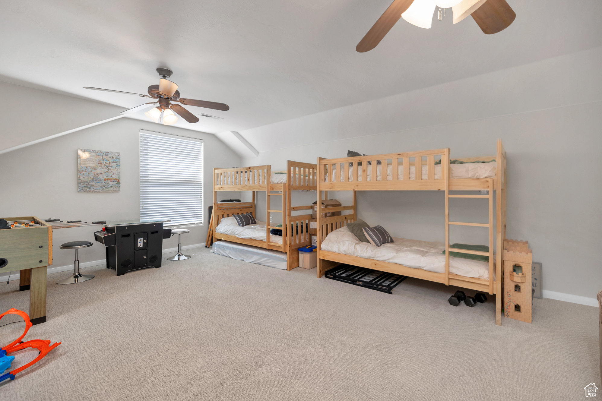 Bedroom with baseboards, a ceiling fan, carpet, and vaulted ceiling