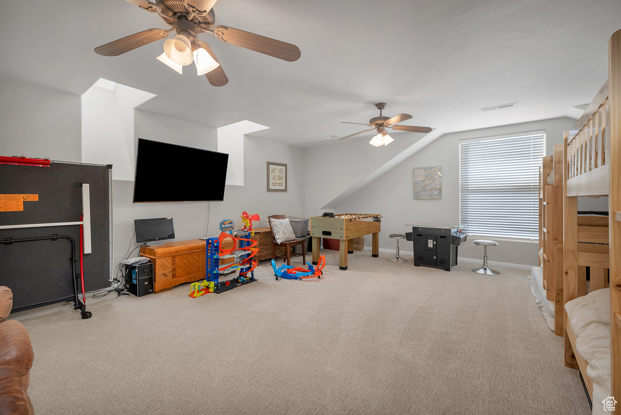 Playroom with visible vents, ceiling fan, baseboards, and carpet floors