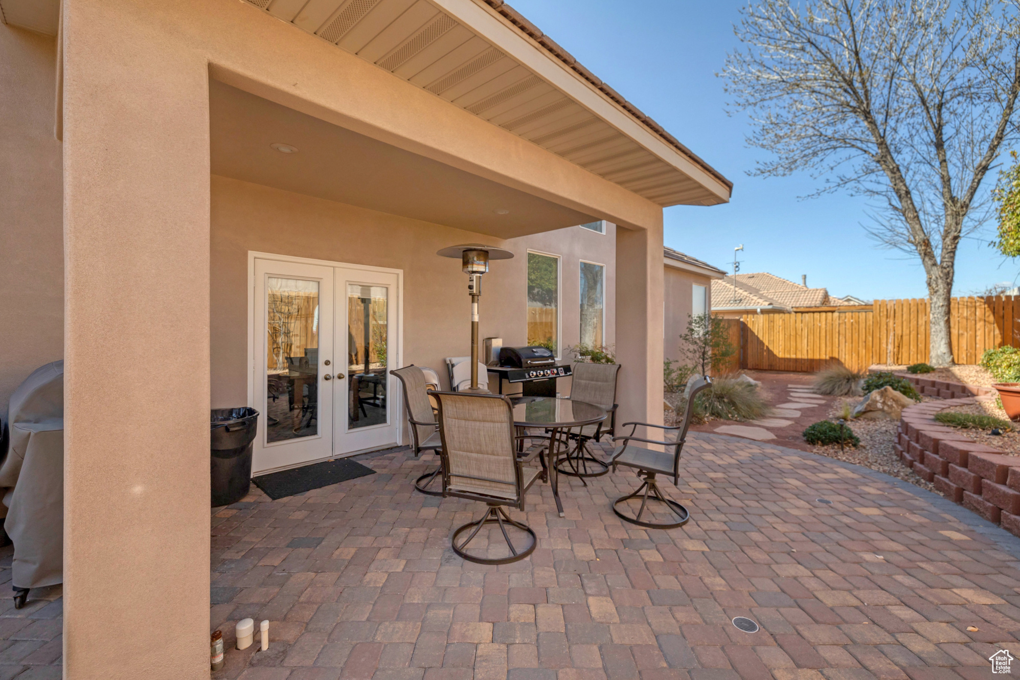 View of patio / terrace with outdoor dining space, area for grilling, french doors, and fence