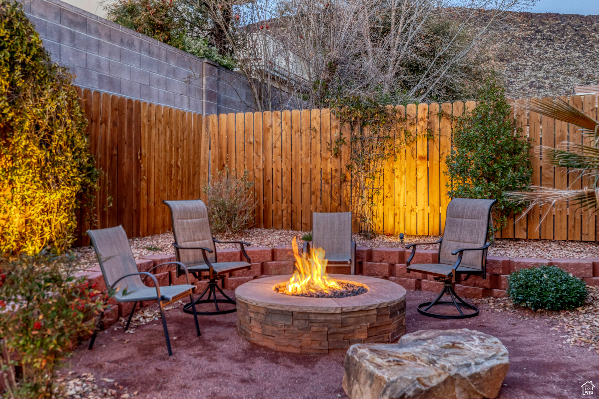 View of patio / terrace with a fenced backyard and a fire pit