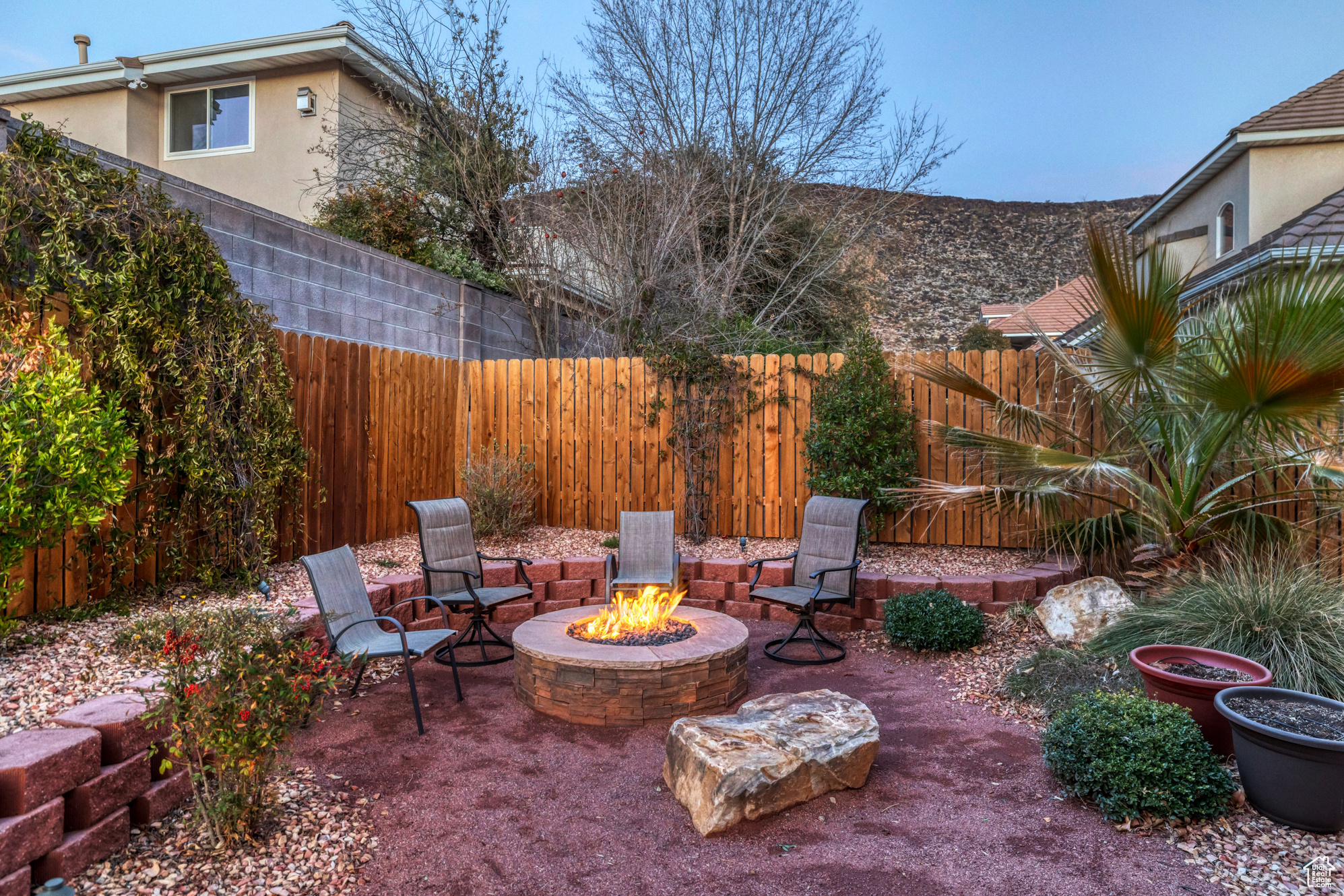 View of patio / terrace with fence private yard and an outdoor fire pit