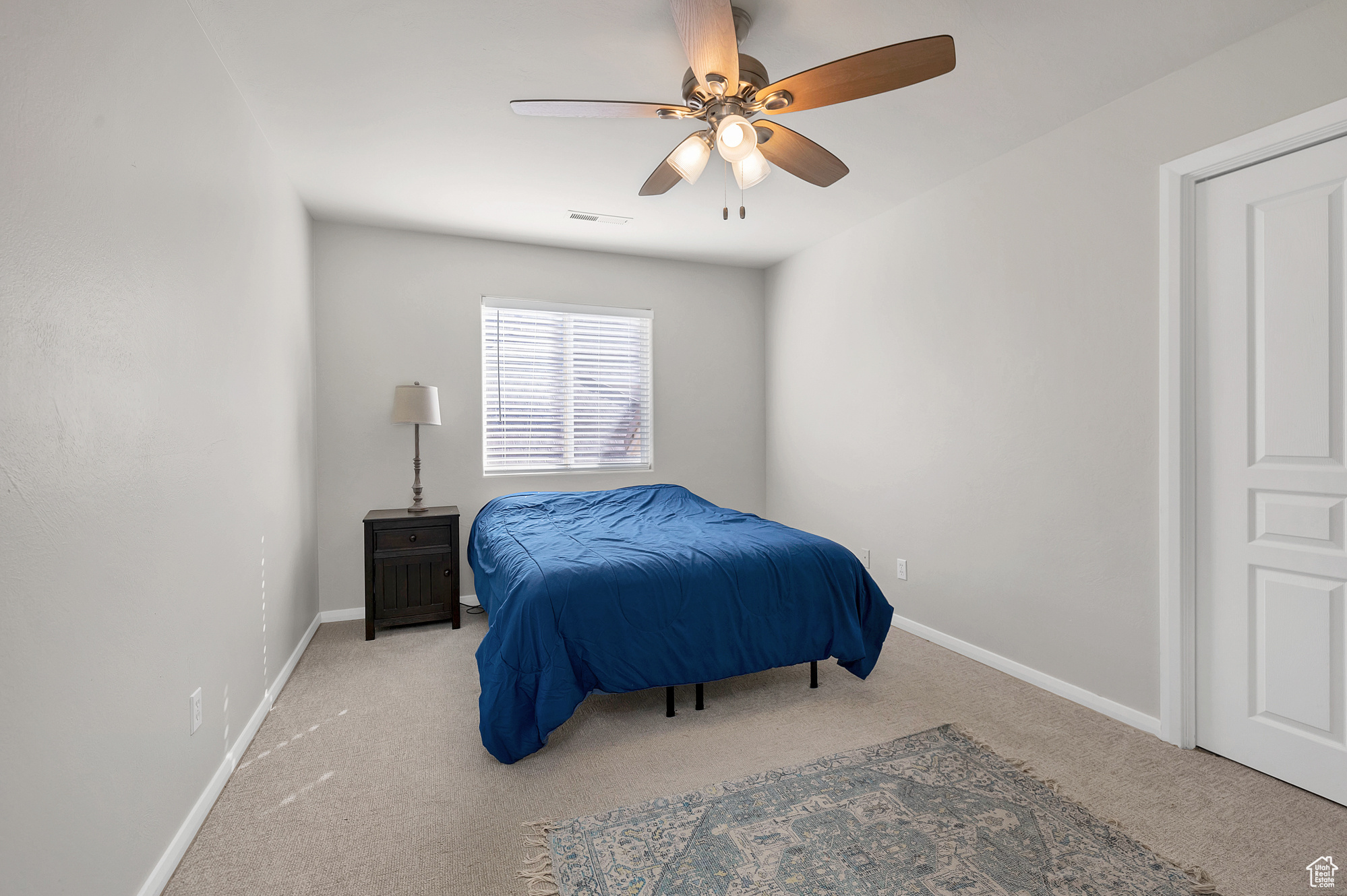 Bedroom with baseboards, carpet floors, and visible vents