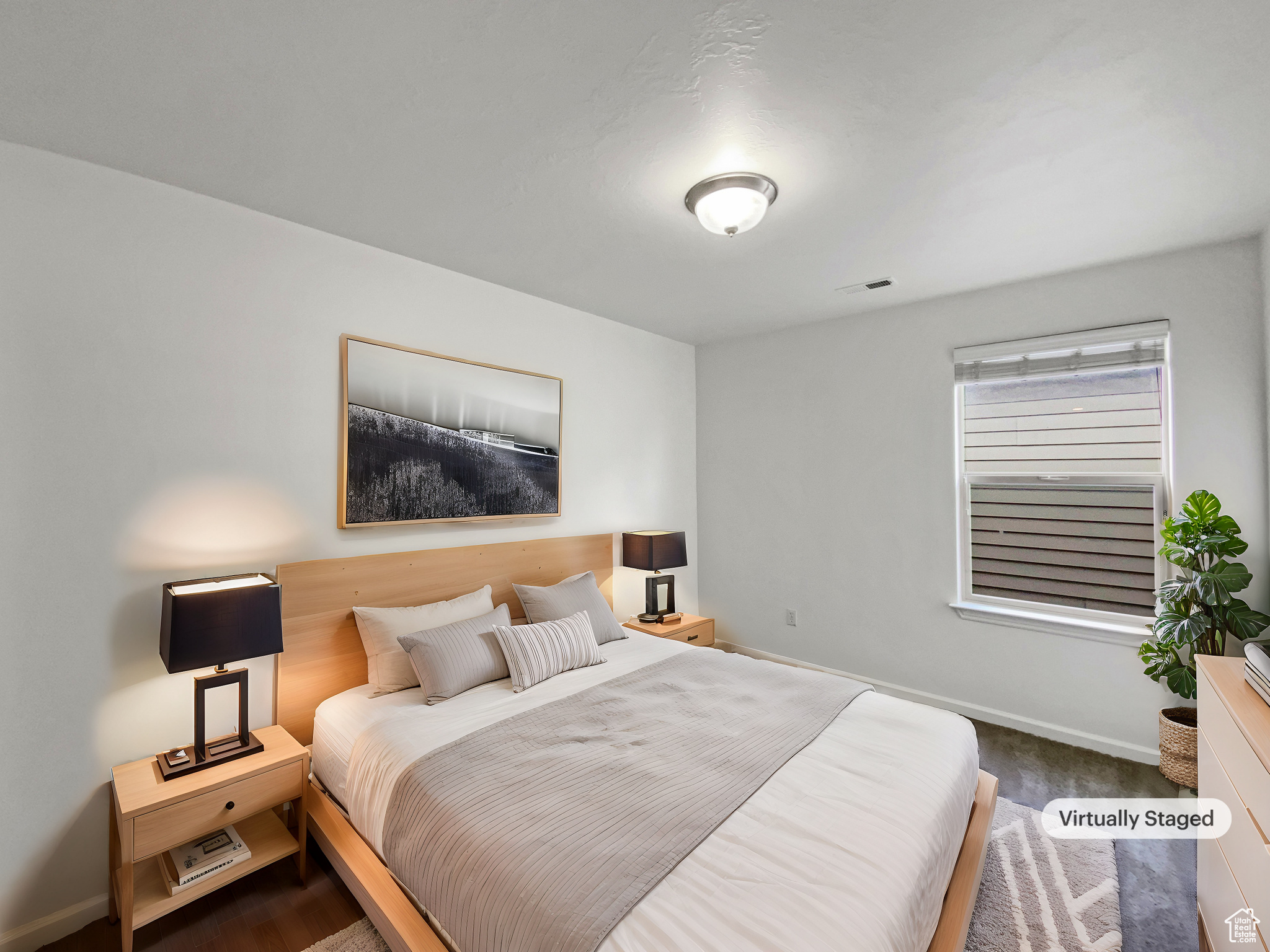 Bedroom with baseboards, visible vents, and dark carpet