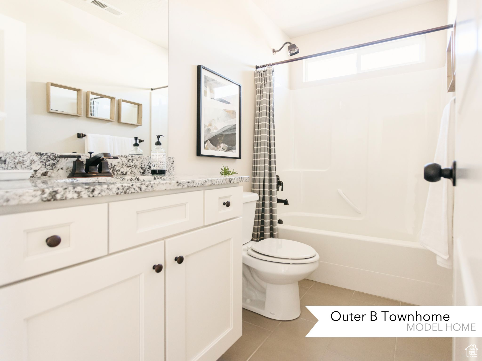 Bathroom with visible vents, toilet, tile patterned floors, shower / bath combination with curtain, and vanity
