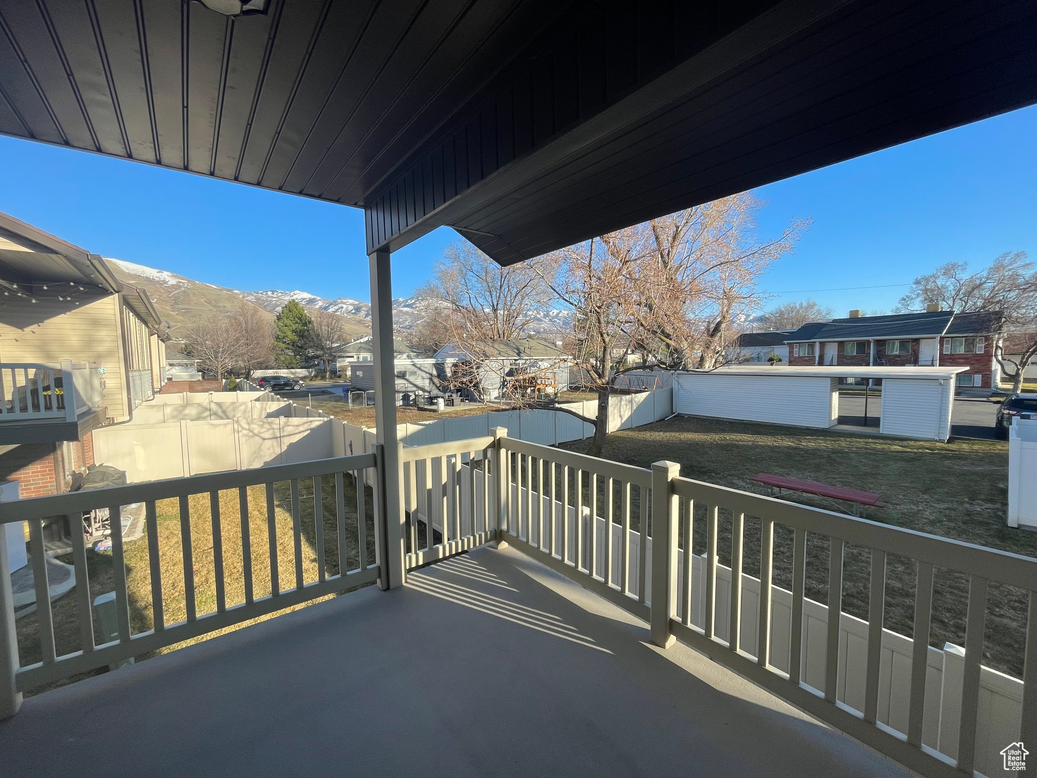 Balcony with a mountain view and an open backyard view
