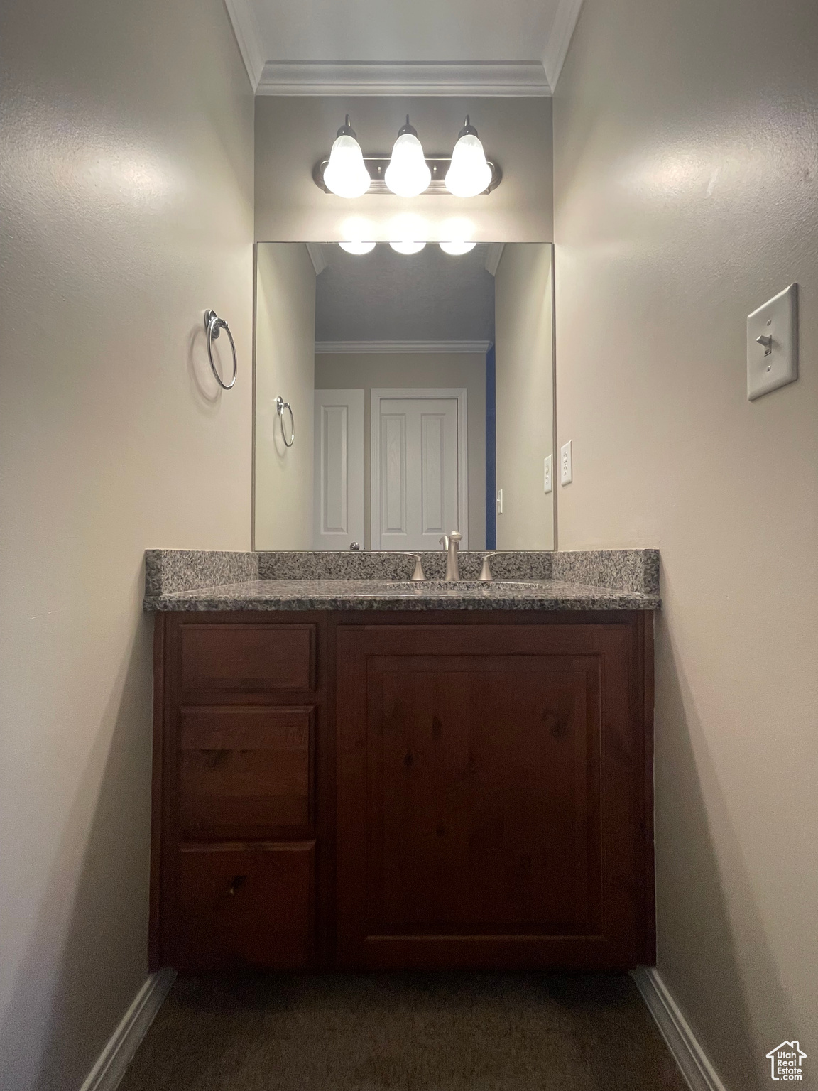 Private vanity in primary bedroom, adjacent to full main bathroom.