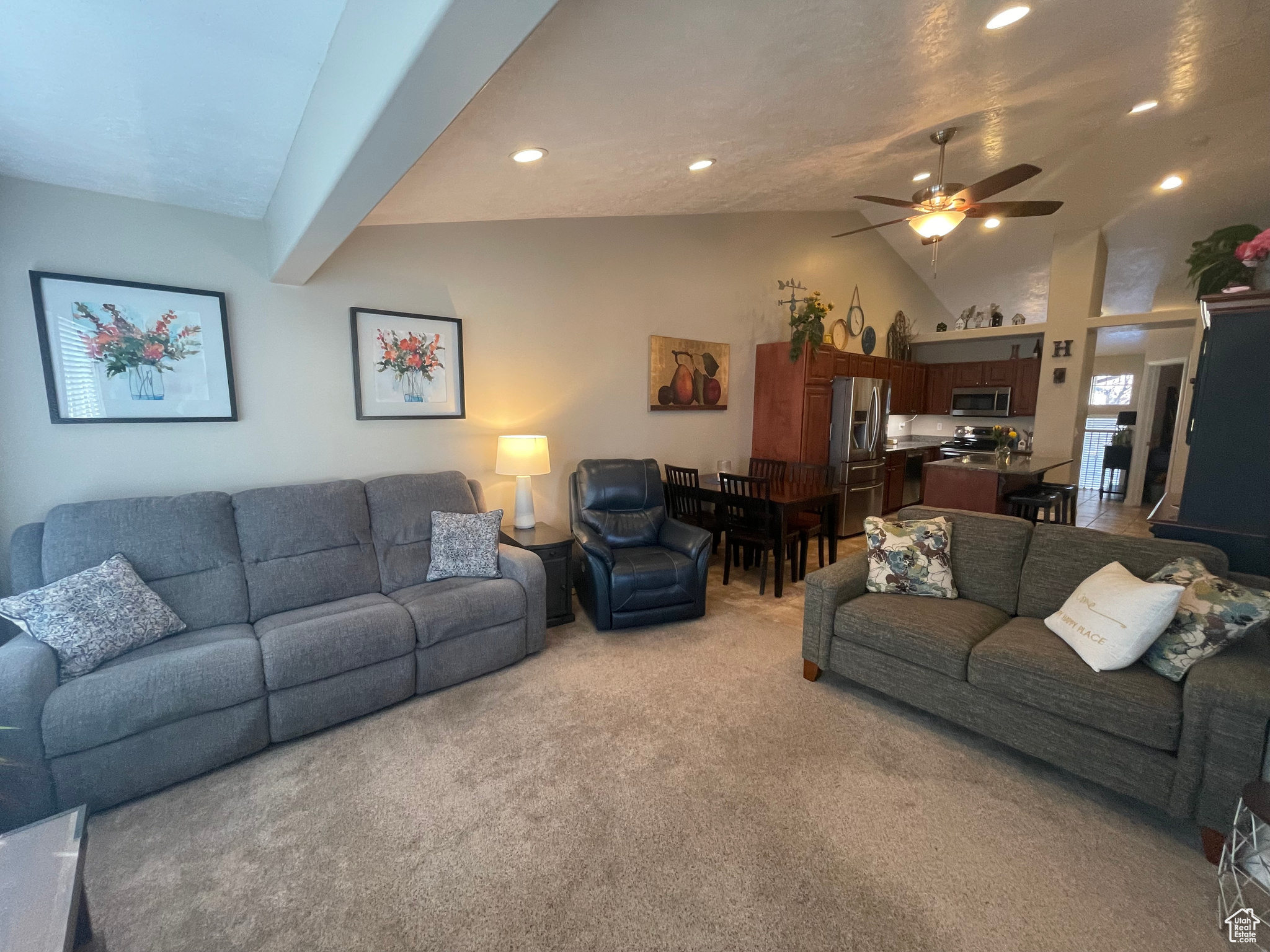 Living area featuring recessed lighting, light neutral carpet, ceiling fan, and vaulted ceiling