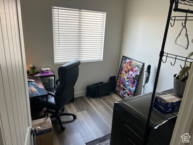 Home office featuring baseboards and light wood finished floors