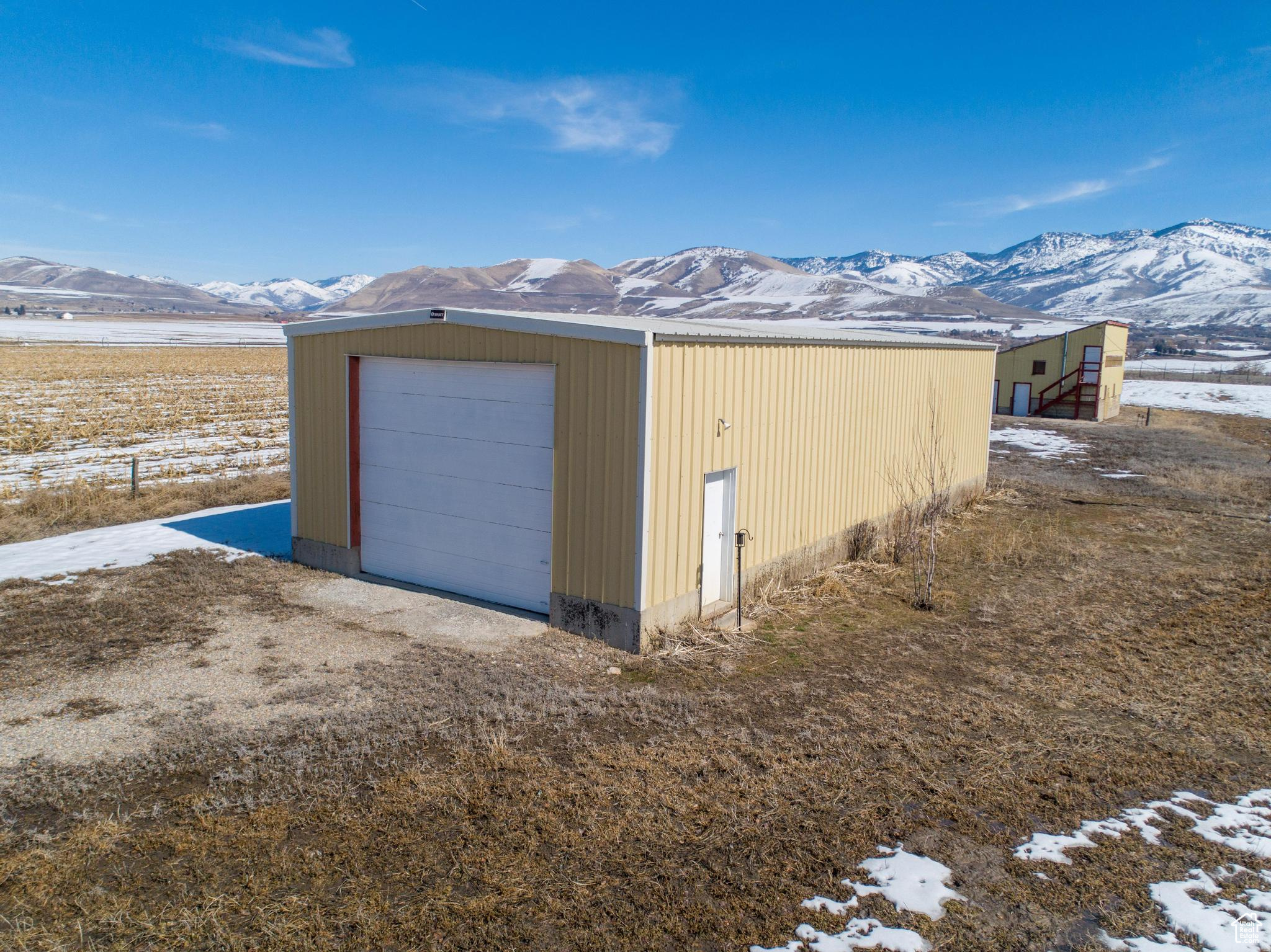 Detached garage featuring a mountain view
