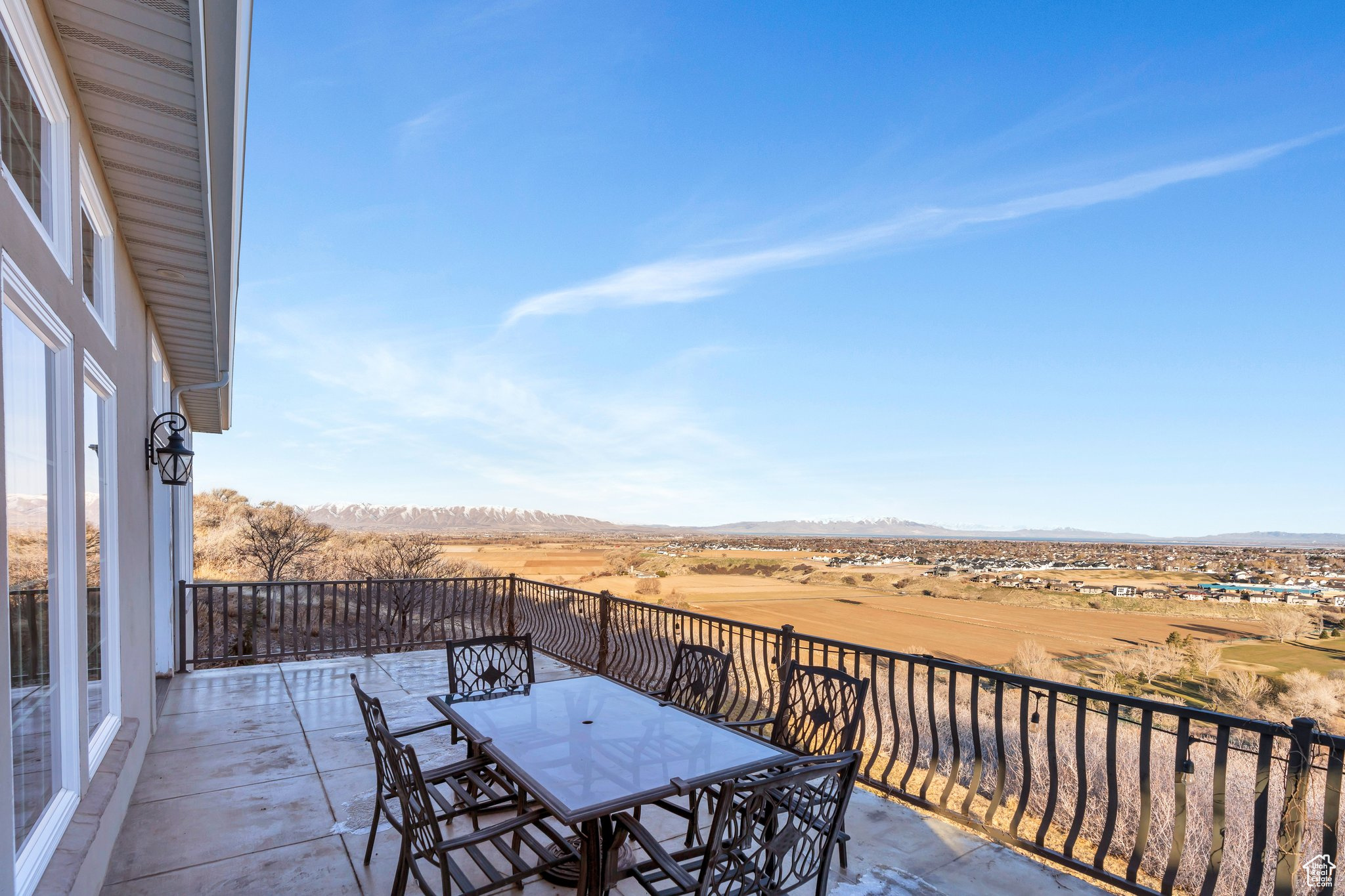 Balcony featuring outdoor dining space and a mountain view