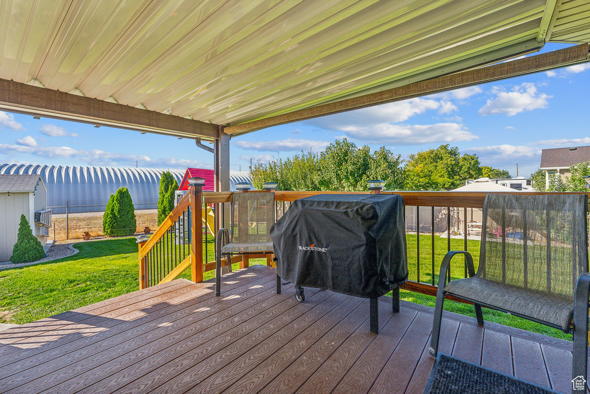 Wooden deck featuring a yard