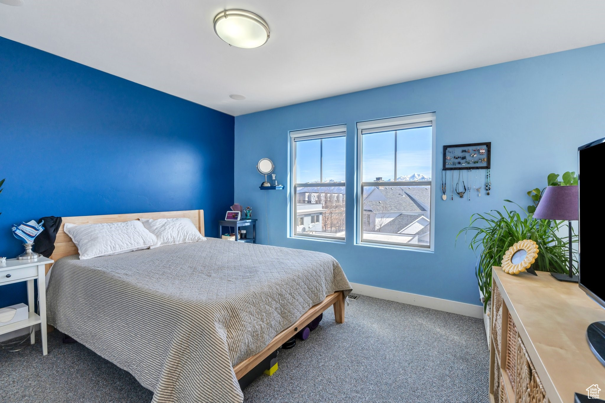 Carpeted bedroom with baseboards