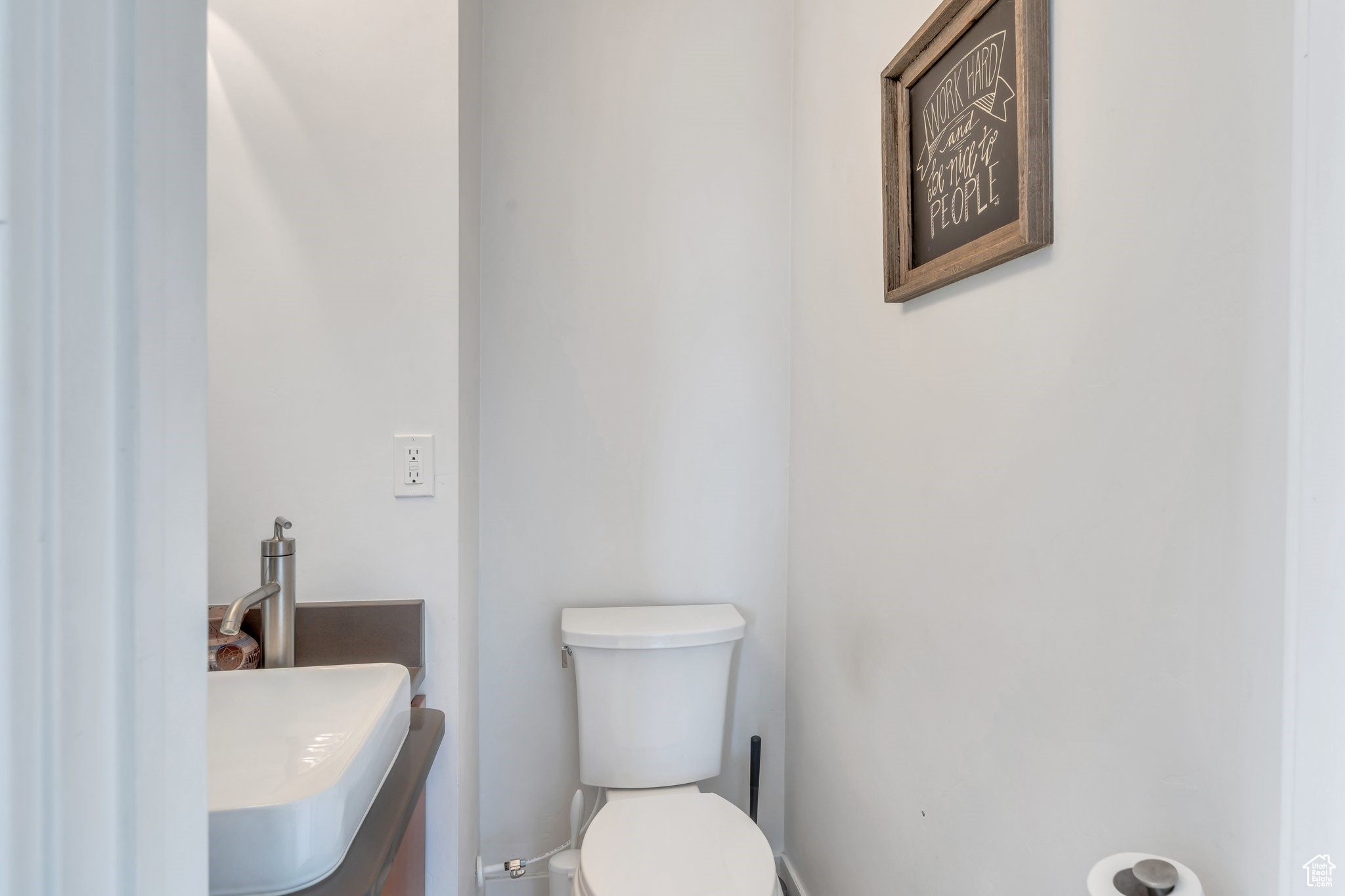 Half bath with toilet and vanity
