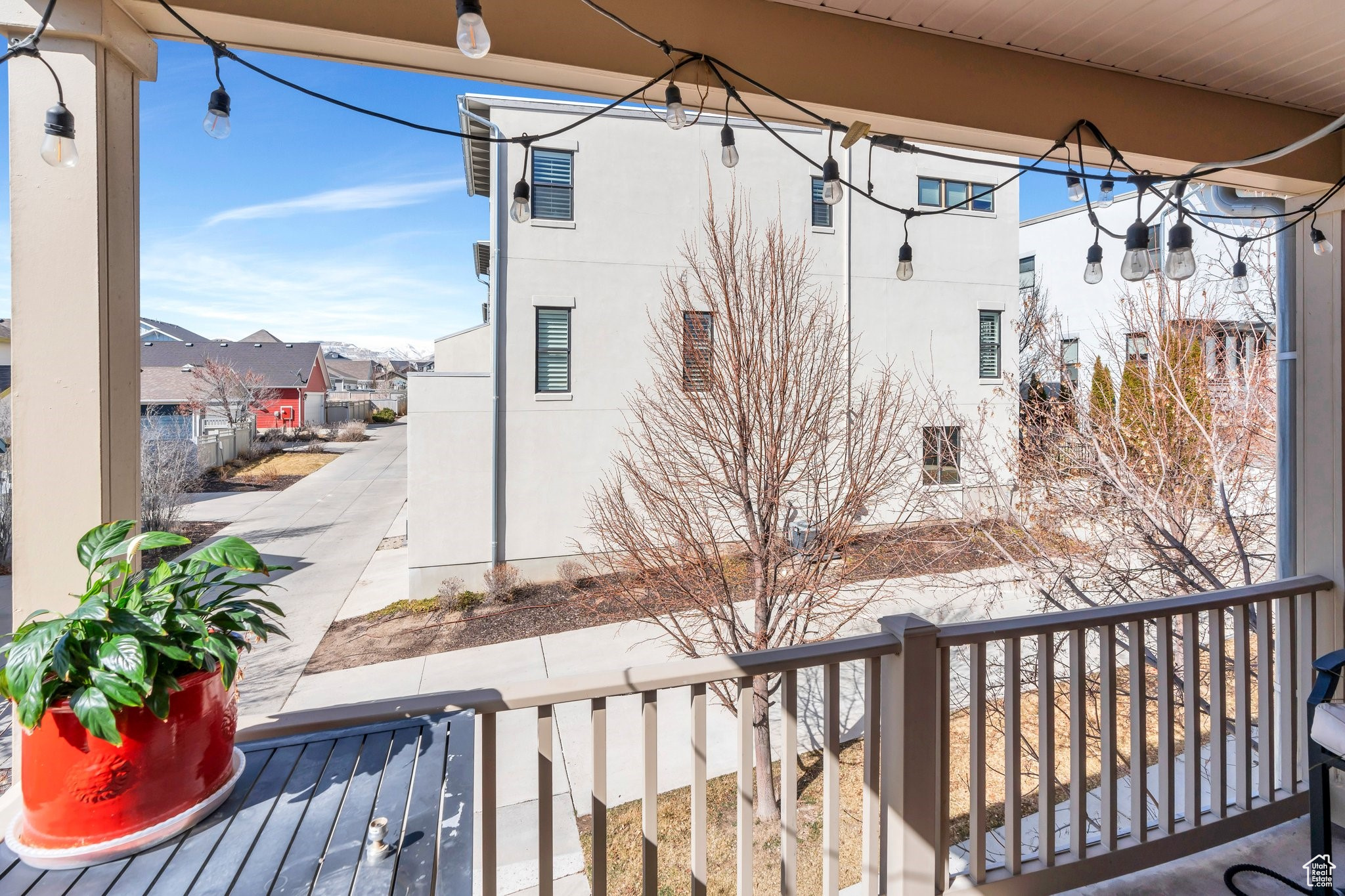 Exterior space featuring stucco siding and a residential view