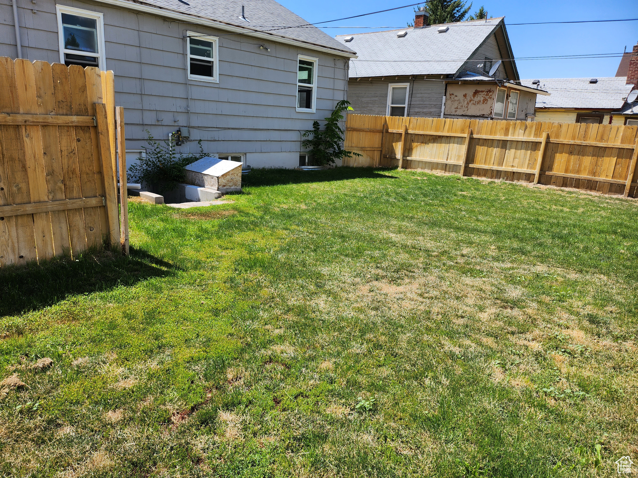 View of yard featuring fence