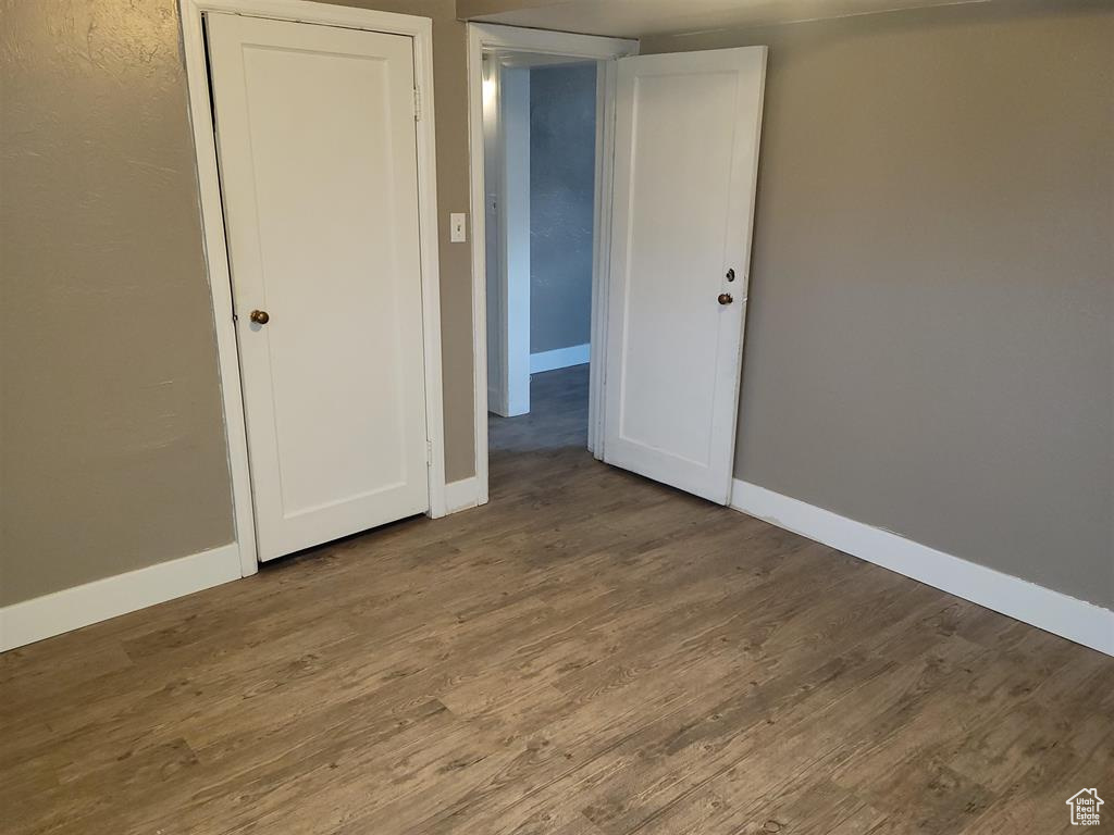 Spare room with wood finished floors and baseboards