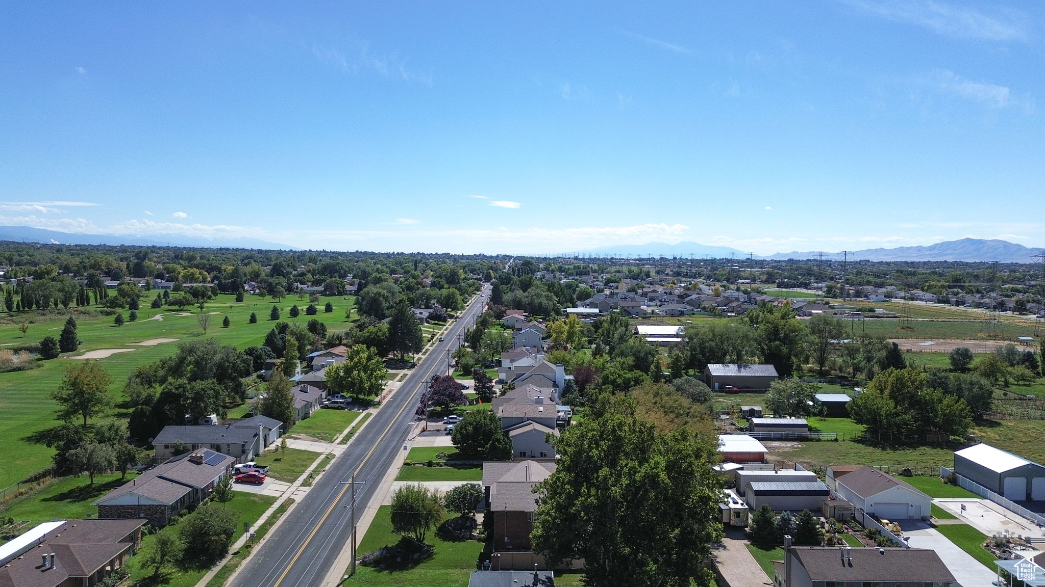 Birds eye view of property with a mountain view and a residential view